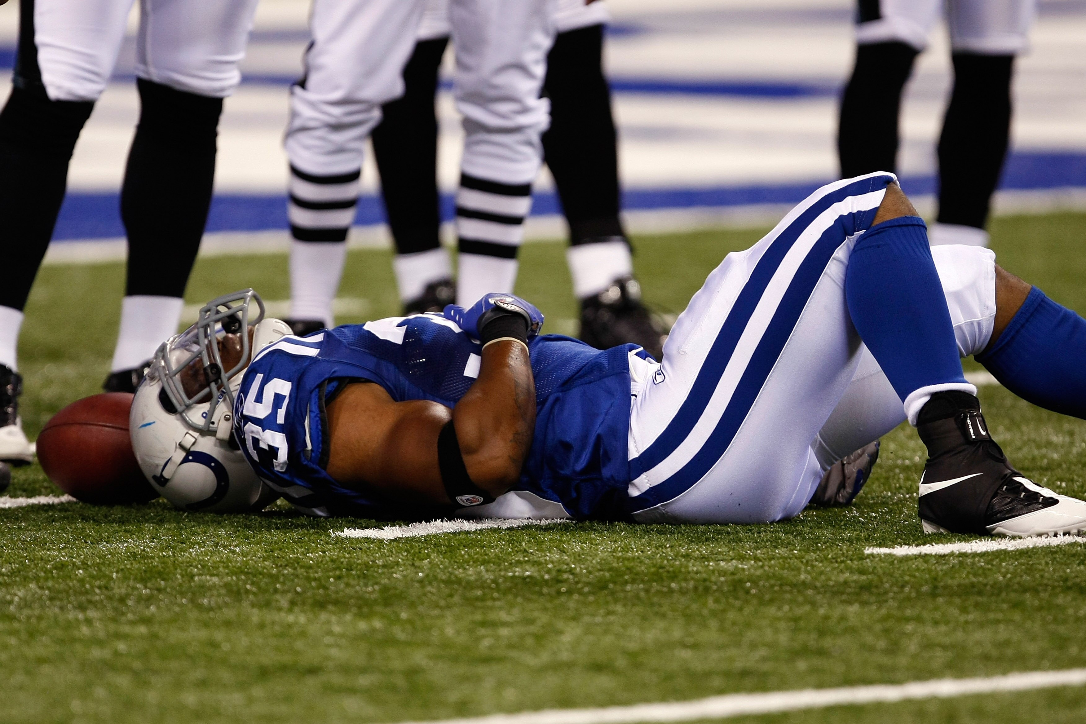INDIANAPOLIS, IN - AUGUST 20: Running back Chad Simpson #35 of the Indianapolis Colts lays on the field injured against the Philadelphia Eagles at Lucas Oil Stadium on August 20, 2009 in Indianapolis, Indiana. (Photo by Scott Boehm/Getty Images)