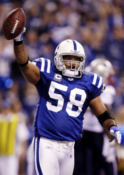 INDIANAPOLIS - NOVEMBER 15:  Gary Brackett #58 of the Indianapolis Colts recovers a fumble against the New England Patriots during the third game at Lucas Oil Stadium on November 15, 2009 in Indianapolis, Indiana.  (Photo by Jamie Squire/Getty Images)