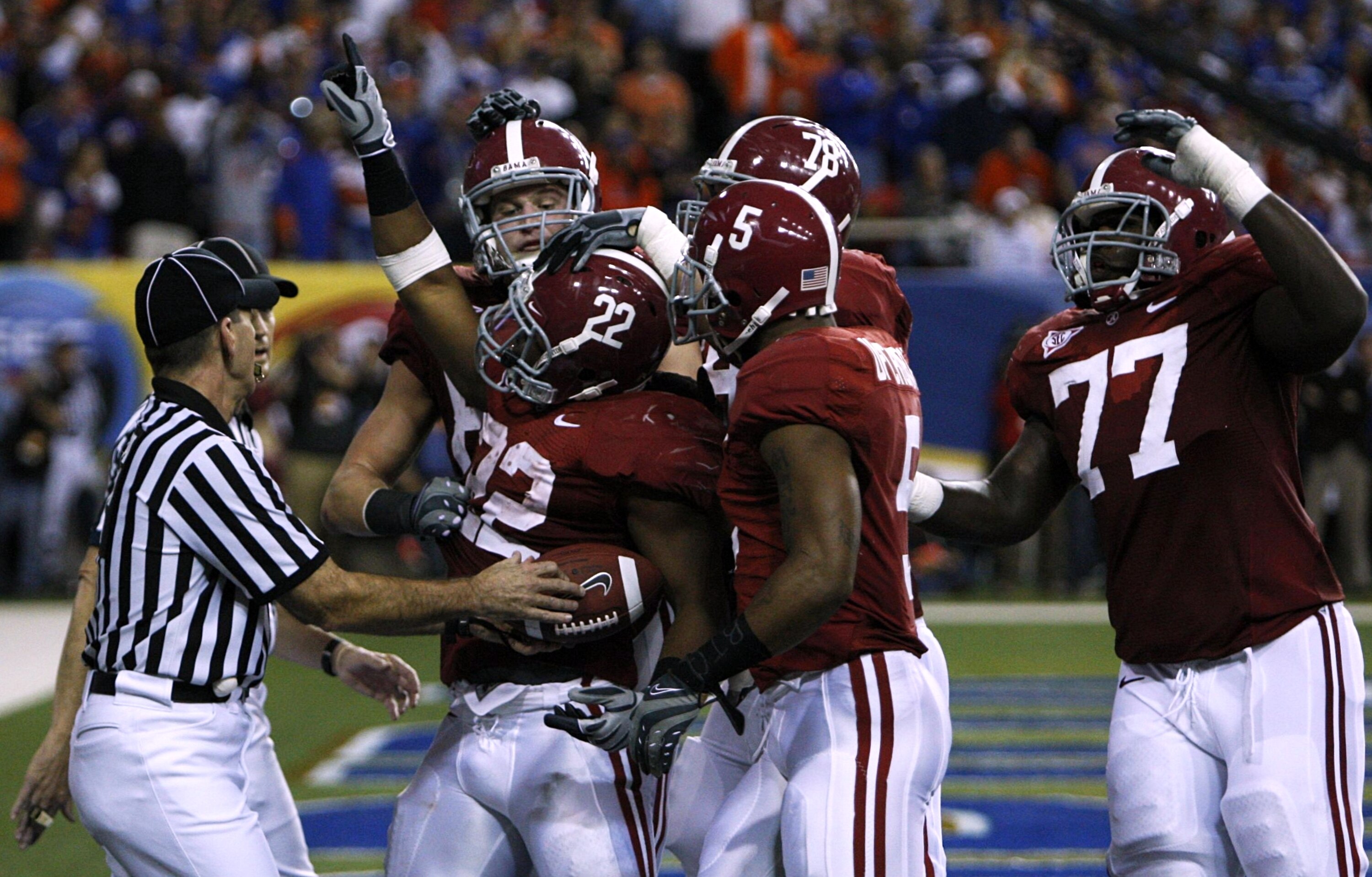 ATLANTA - DECEMBER 5:  Mark Ingram #22 of the Alabama Crimson Tidecelebrates with teammates after he scored a 3-yard rushing touchdown in the second quarter against the Florida Gators during the SEC Championship game at Georgia Dome on December 5, 2009 in