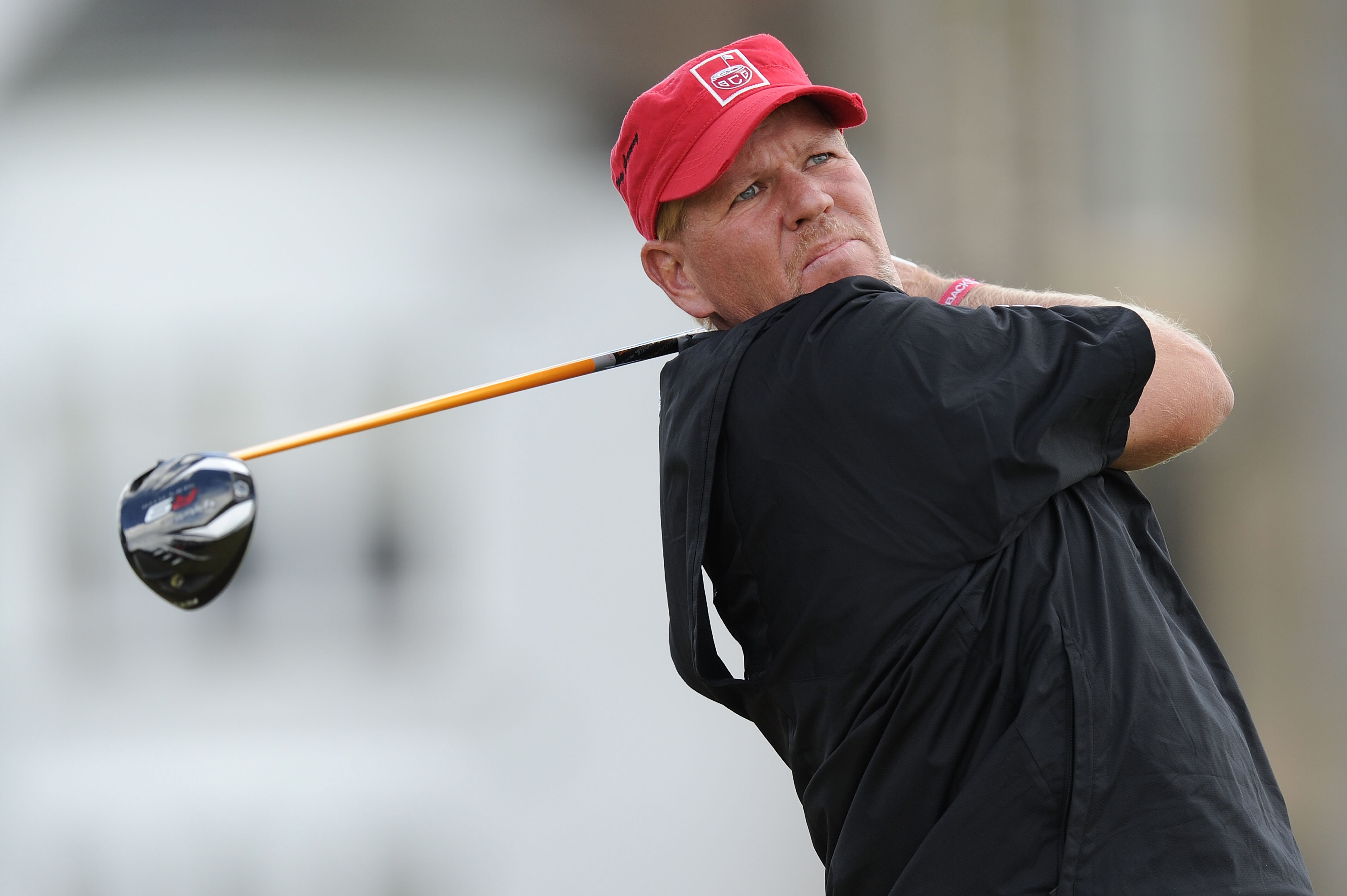 ST ANDREWS, SCOTLAND - JULY 17:  John Daly of the USA tees off on the second hole during the third round of the 139th Open Championship on the Old Course, St Andrews on July 17, 2010 in St Andrews, Scotland.  (Photo by Harry How/Getty Images)