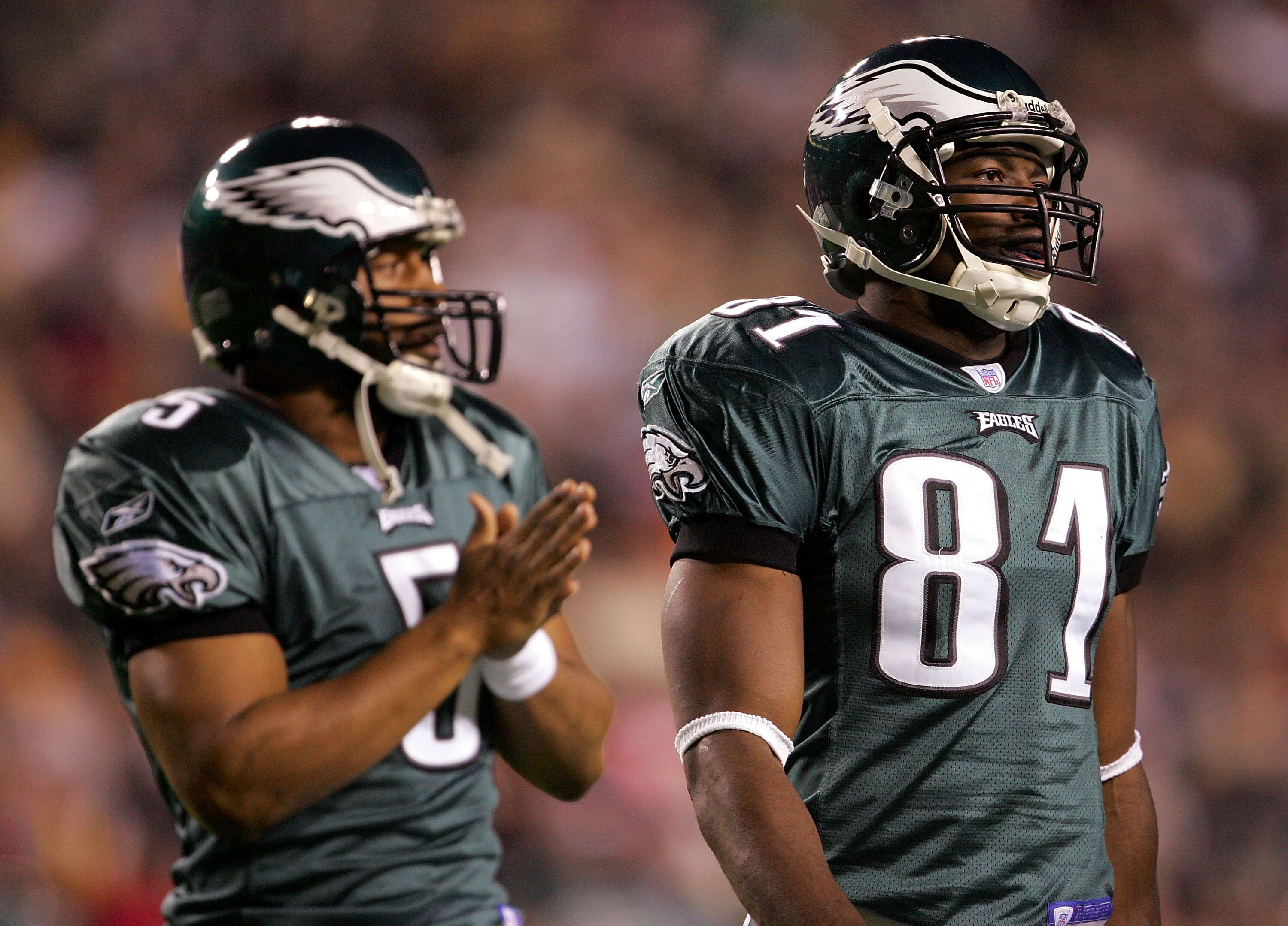 LANDOVER, MD - DECEMBER 12:   Reciever Terrell Owens #81 and quarterback Donovan McNabb #5 of the Philadelphia Eagles watch during the first half of the game against the Washington Redskins at Fed Ex Field on December 12, 2004 in Landover, Maryland.  (Pho