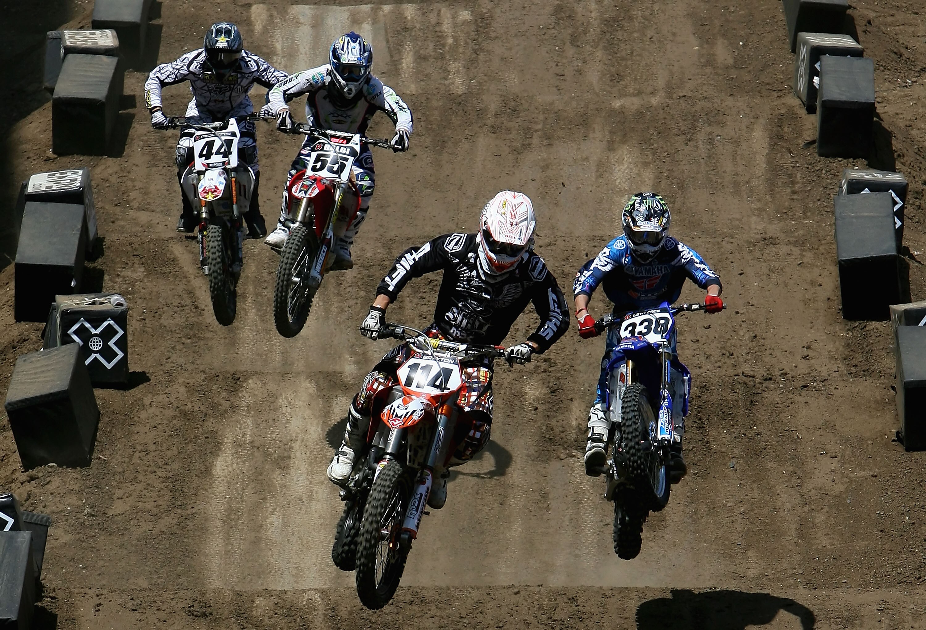 CARSON, CA - AUGUST 02:  (L-R) Troy Adams, Antonio Balbi of Brazil, Justin Brayton and Jason Lawrence compete in the men's Moto X Racing final during the summer X Games 14 at Home Depot Center on August 2, 2008 in Carson, California.  (Photo by Christian