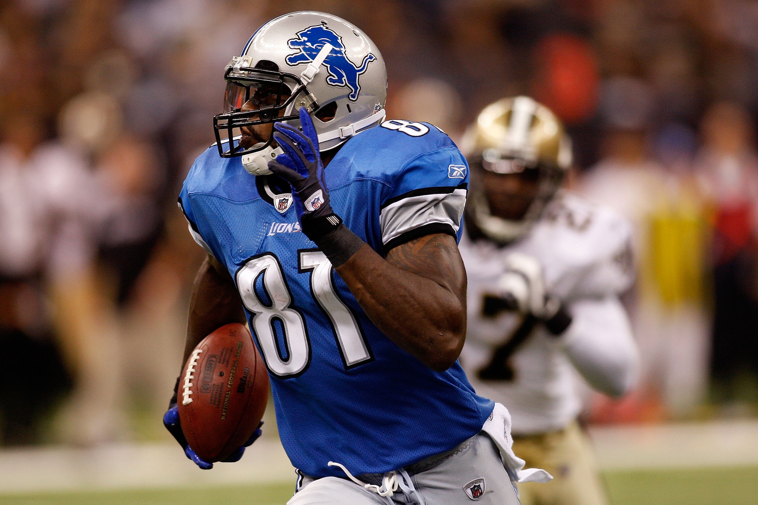 NEW ORLEANS - SEPTEMBER 13:  Calvin Johnson #81 of the Detroit Lions runs past Malcom Jenkins #27 of the New Orleans Saints at the Louisiana Superdome on September 13, 2009 in New Orleans, Louisiana. The Saints defeated the Lions 45-27.  (Photo by Chris G