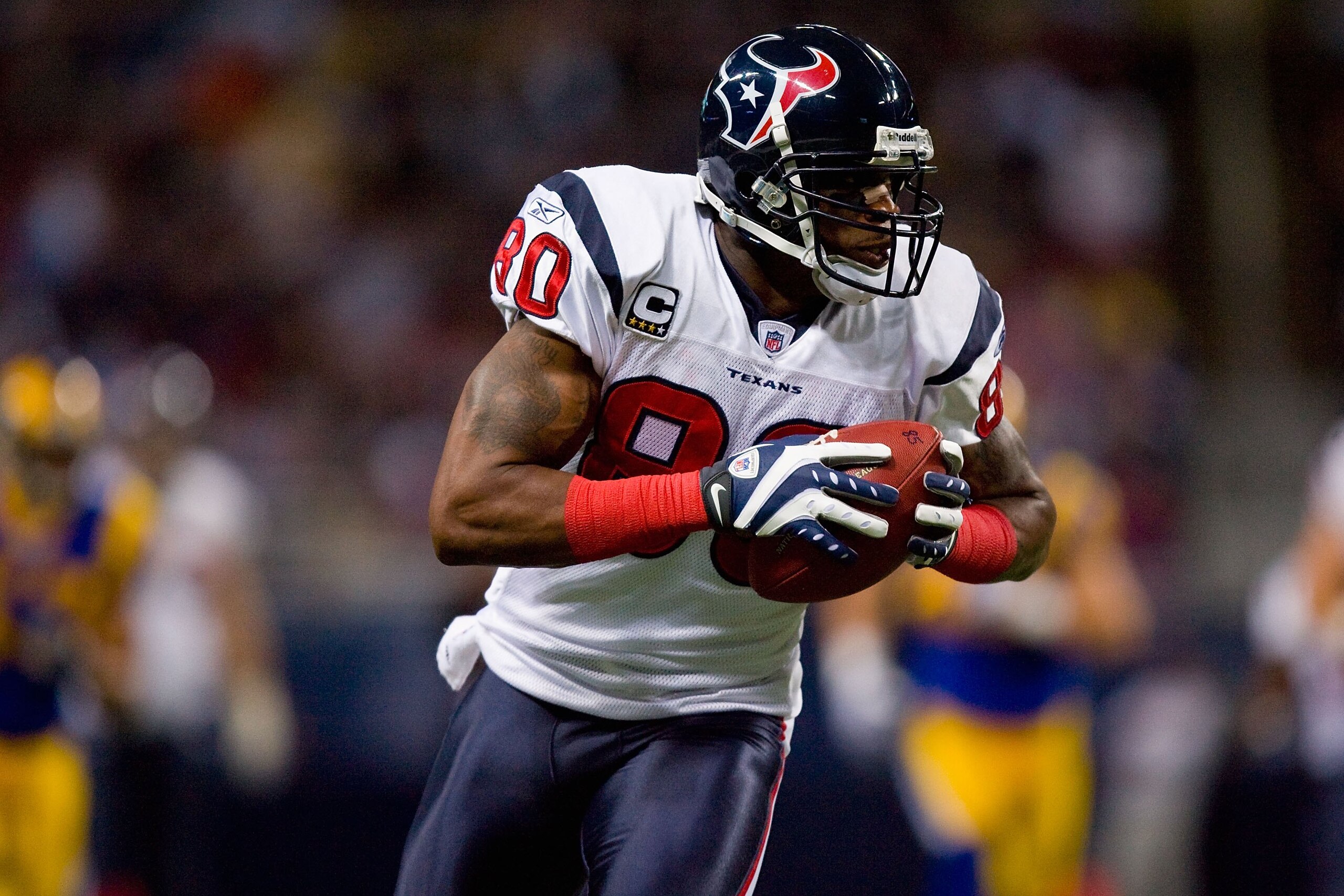 ST. LOUIS - DECEMBER 20:  Andre Johnson #80 of the Houston Texans carries the ball during the game against the St. Louis Rams at Edward Jones Dome on December 20, 2009 in St. Louis, Missouri.  (Photo by Dilip Vishwanat/Getty Images)