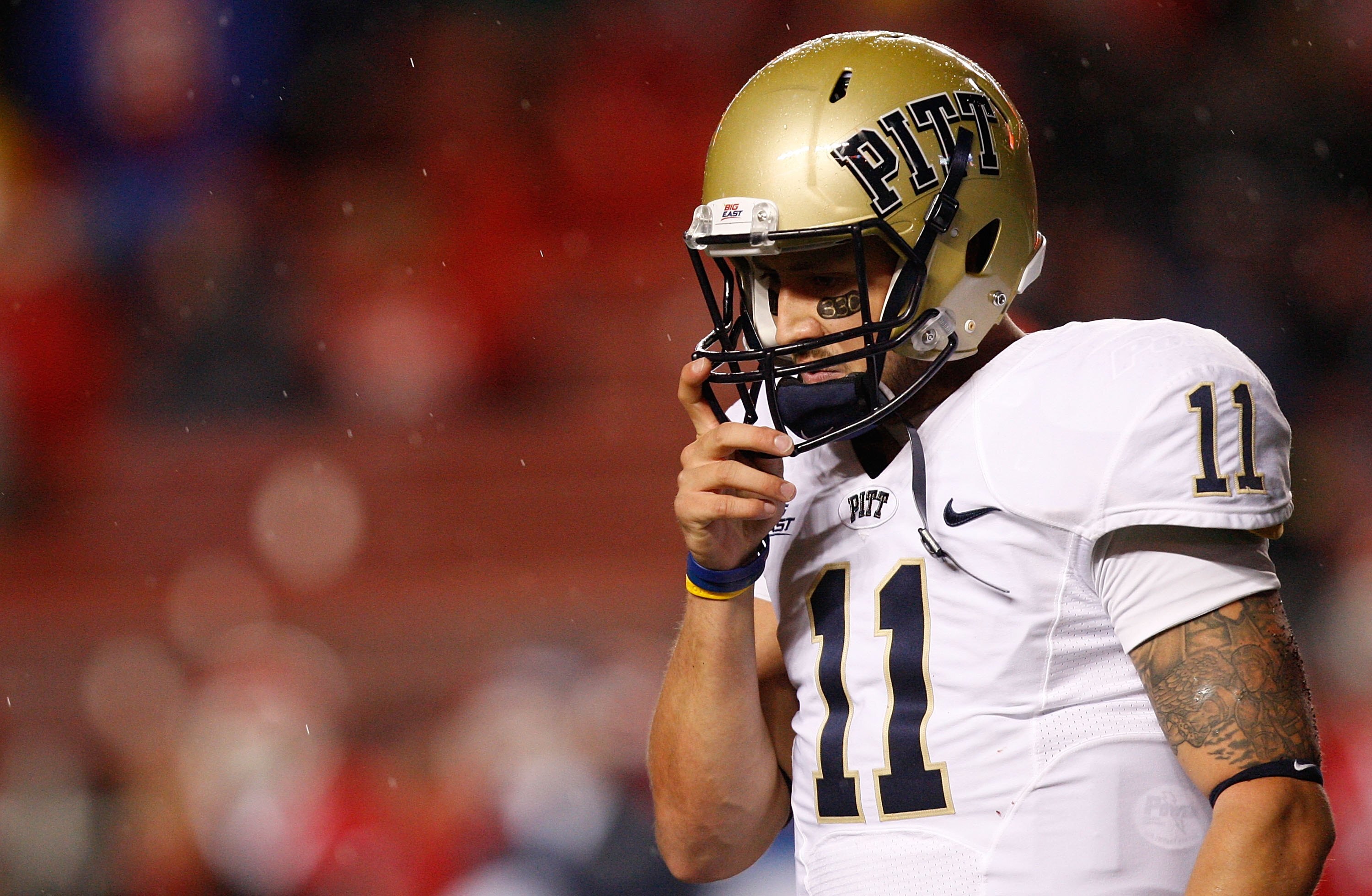 PISCATAWAY, NJ - OCTOBER 16:  Bill Stull #11 of the University of Pittsburgh Panthers walks off the field after third down against Rutgers University Scarlet Knights on October 16, 2009 at Rutgers Stadium in Piscataway, New Jersey.  (Photo by Jared Wicker