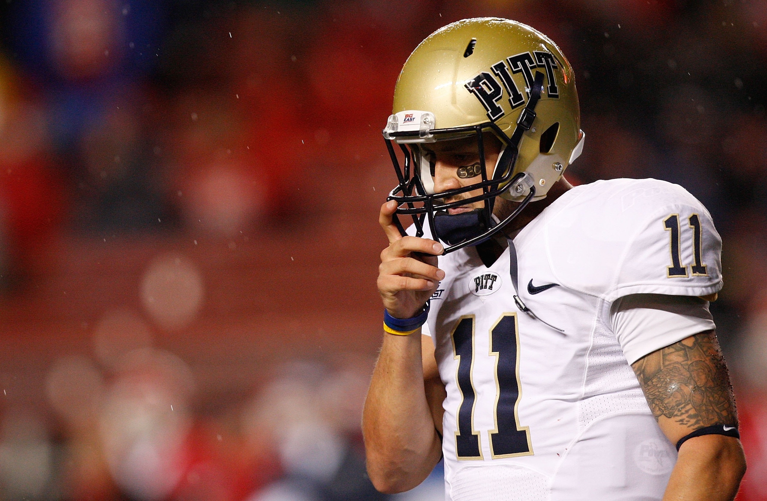 PISCATAWAY, NJ - OCTOBER 16:  Bill Stull #11 of the University of Pittsburgh Panthers walks off the field after third down against Rutgers University Scarlet Knights on October 16, 2009 at Rutgers Stadium in Piscataway, New Jersey.  (Photo by Jared Wicker