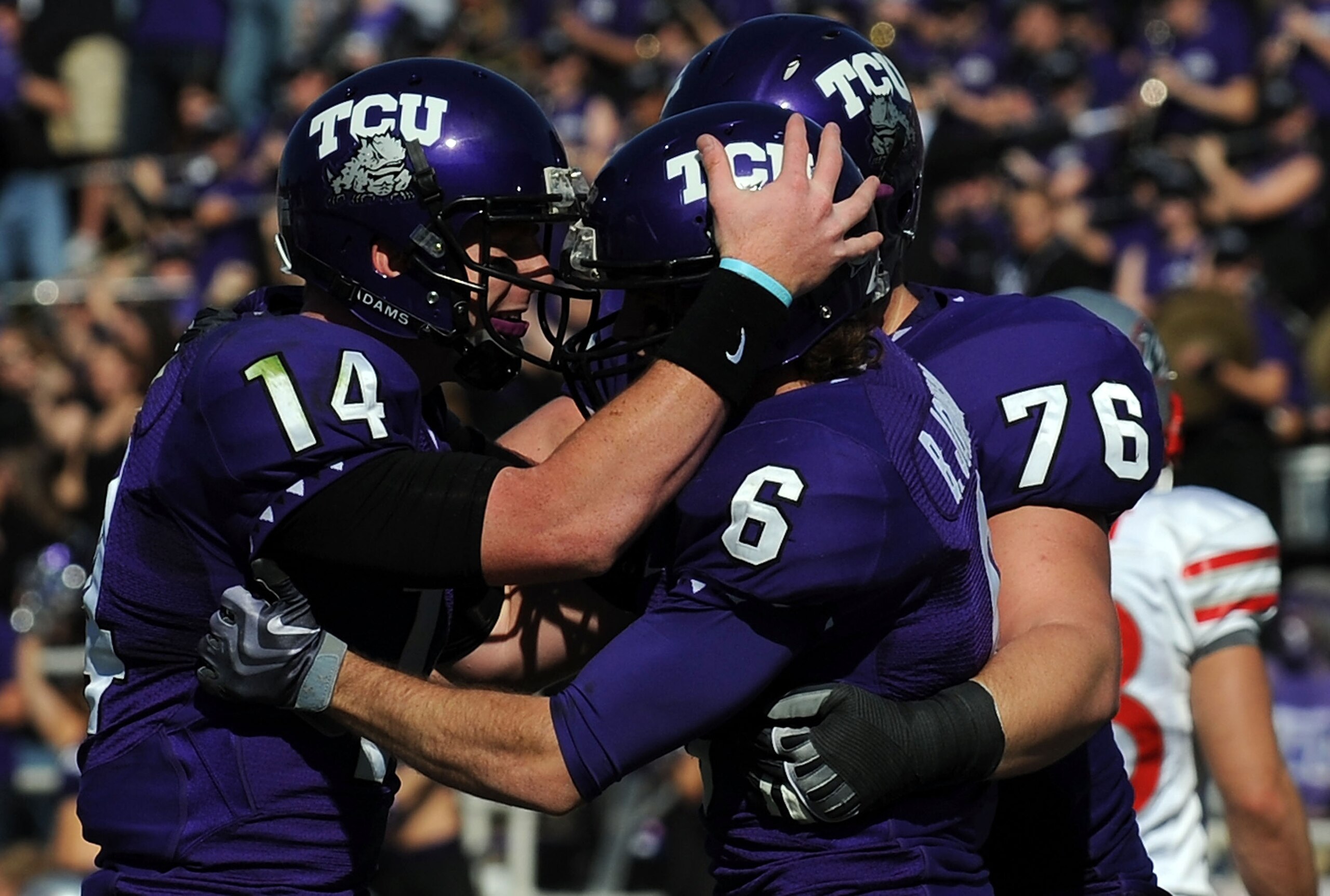 FORT WORTH, TX - NOVEMBER 28:  Quarterback Andy Dalton #14 of the TCU Horned Frogs celebrates a  touchdown with Bart Johnson #6 against the New Mexico Lobos at Amon G. Carter Stadium on November 28, 2009 in Fort Worth, Texas.  (Photo by Ronald Martinez/Ge