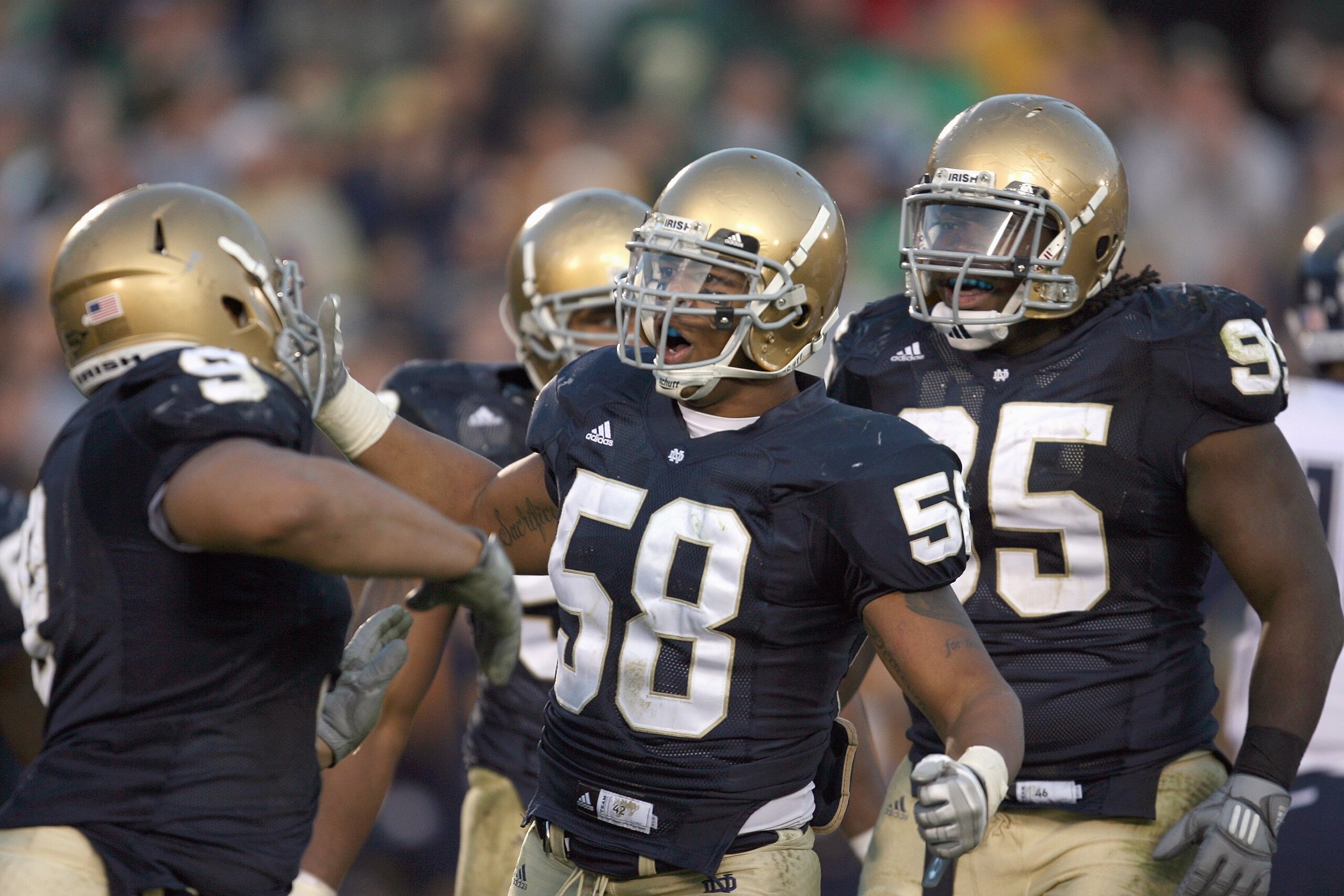 SOUTH BEND, IN - NOVEMBER 21: Brian Smith #58 of the Notre Dame Fighting Irish celebrates with teammates during the game against the Univeristy of Connecticut Huskies at Notre Dame Stadium on November 21, 2009 in South Bend, Indiana. Connecticut defeated SOUTH BEND, IN - NOVEMBER 21: Brian Smith #58 of the Notre Dame Fighting Irish celebrates with teammates during the game against the Univeristy of Connecticut Huskies at Notre Dame Stadium on November 21, 2009 in South Bend, Indiana. Connecticut defeated