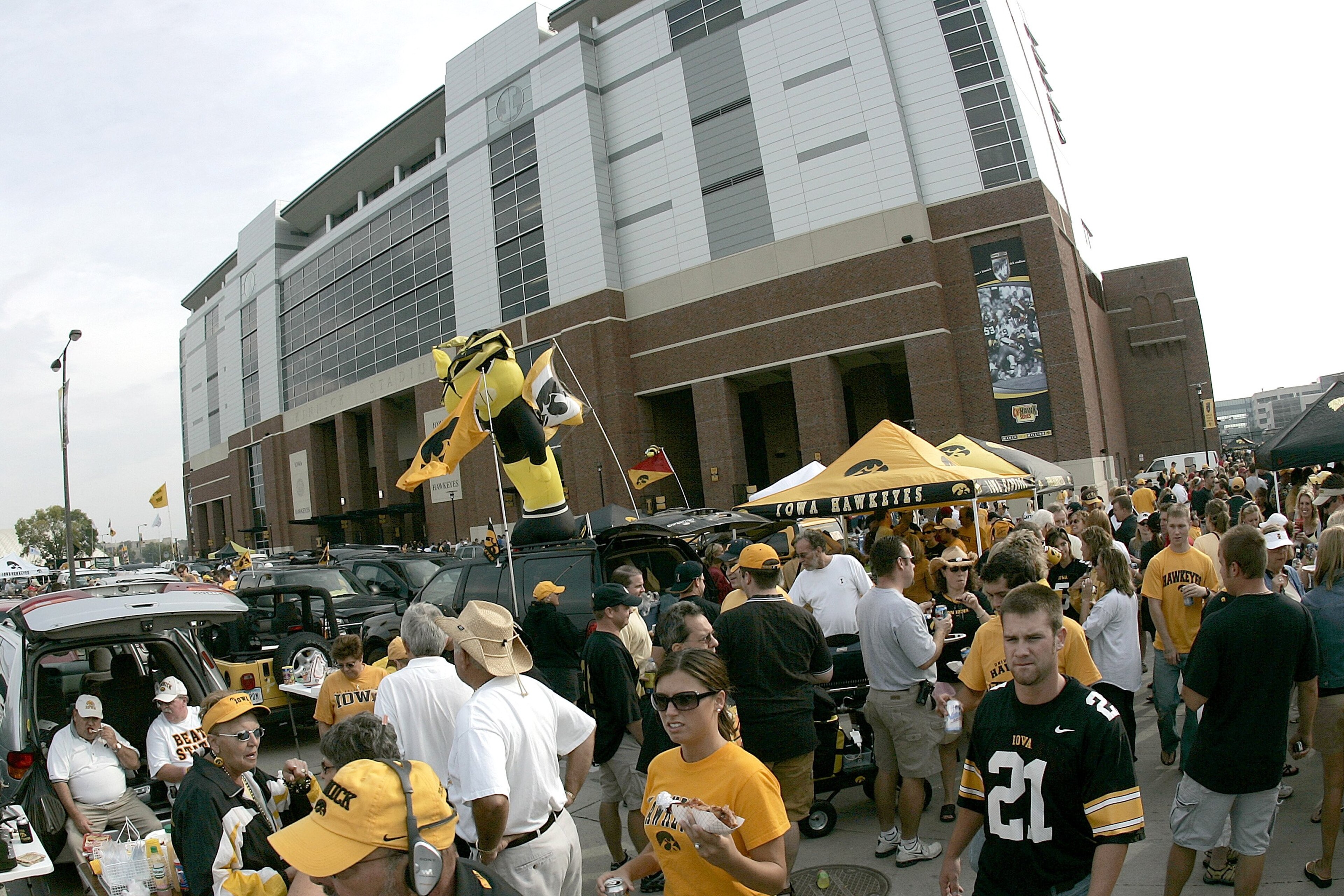 IOWA CITY, IA - SEPTEMBER 16: Fans tailgate outside the newly renovated Kinnick Stadium prior to the game between the Iowa Hawkeyes against the Iowa State Cyclones at Kinnick Stadium on September 16, 2006 in Iowa City, Iowa. The Hawkeyes defeated Cyclones IOWA CITY, IA - SEPTEMBER 16: Fans tailgate outside the newly renovated Kinnick Stadium prior to the game between the Iowa Hawkeyes against the Iowa State Cyclones at Kinnick Stadium on September 16, 2006 in Iowa City, Iowa. The Hawkeyes defeated Cyclones
