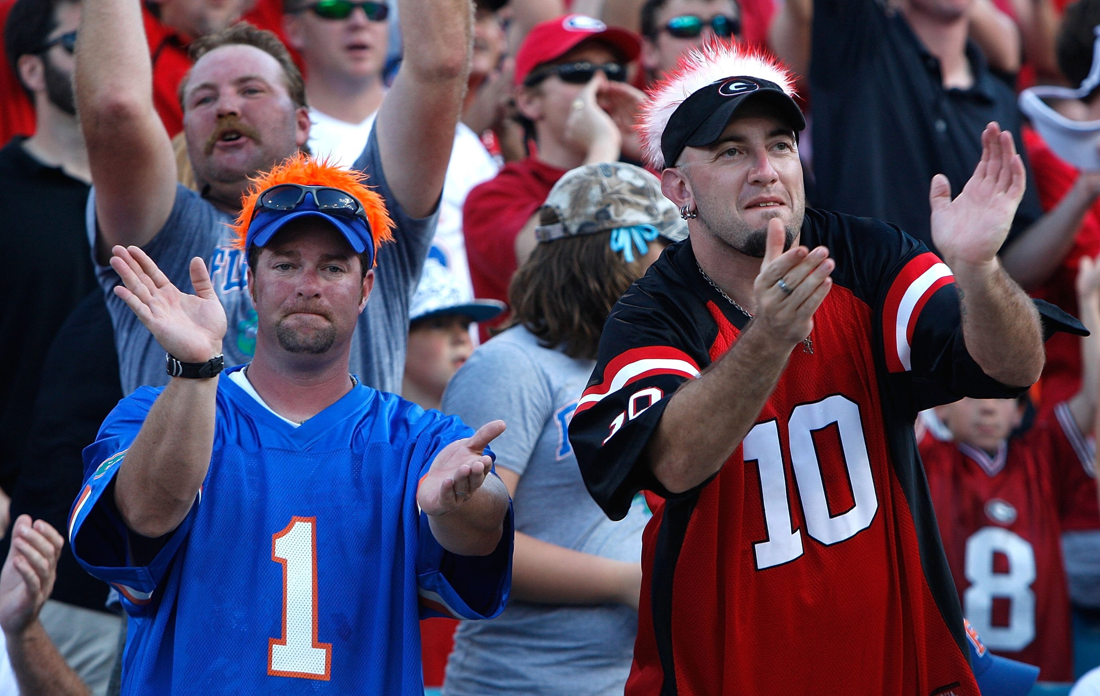 JACKSONVILLE, FL - OCTOBER 31: A fan of the Florida Gators and a fan of the Georgia Bulldogs cheer beside one another at Jacksonville Municipal Stadium on October 31, 2009 in Jacksonville, Florida. (Photo by Kevin C. Cox/Getty Images) JACKSONVILLE, FL - OCTOBER 31: A fan of the Florida Gators and a fan of the Georgia Bulldogs cheer beside one another at Jacksonville Municipal Stadium on October 31, 2009 in Jacksonville, Florida. (Photo by Kevin C. Cox/Getty Images)