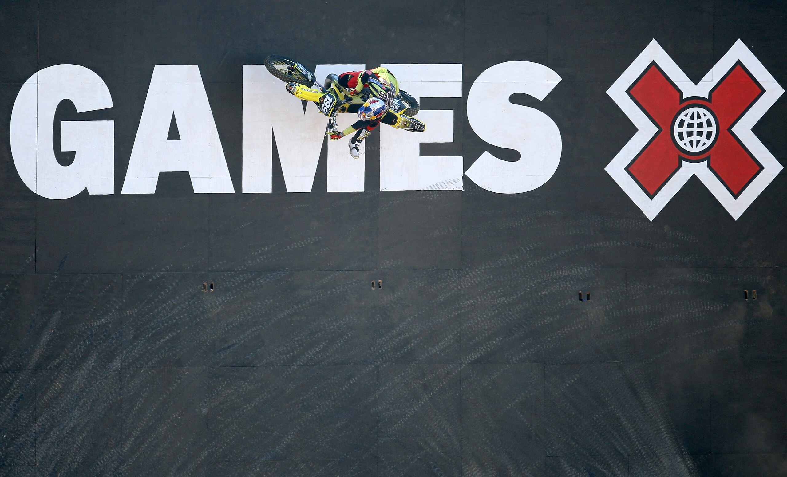 LOS ANGELES, CA - JULY 29: Travis Pastrana #199 climbs up a wall during the Moto X Freestyle Round One at the Los Angeles Coliseum during X Games 16 on July 29, 2010 in Los Angeles, California. (Photo by Stephen Dunn/Getty Images) LOS ANGELES, CA - JULY 29: Travis Pastrana #199 climbs up a wall during the Moto X Freestyle Round One at the Los Angeles Coliseum during X Games 16 on July 29, 2010 in Los Angeles, California. (Photo by Stephen Dunn/Getty Images)