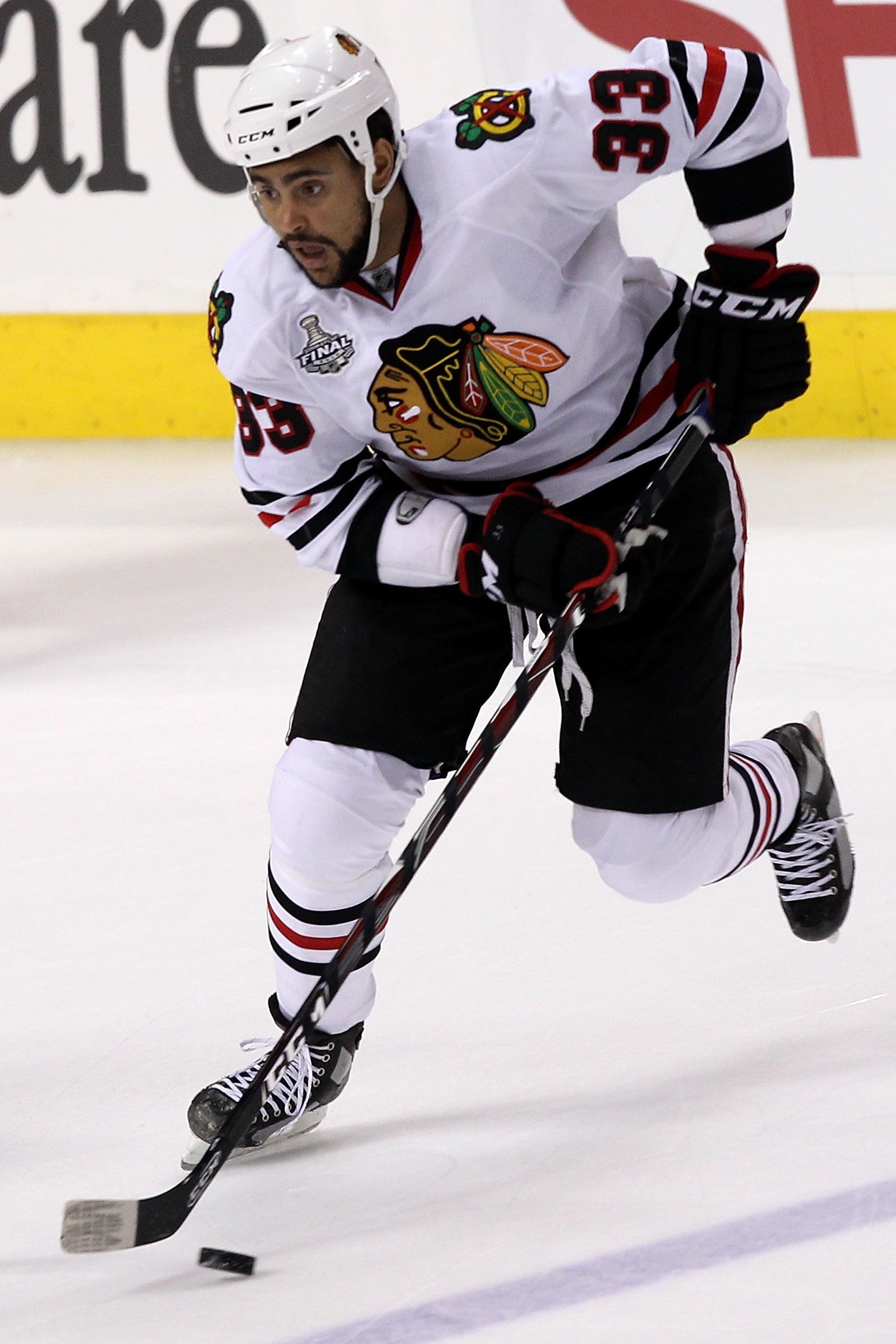 PHILADELPHIA - JUNE 04:  Dustin Byfuglien #33 of the Chicago Blackhawks handles the puck against the Philadelphia Flyers in Game Four of the 2010 NHL Stanley Cup Final at Wachovia Center on June 4, 2010 in Philadelphia, Pennsylvania.  (Photo by Andre Ring