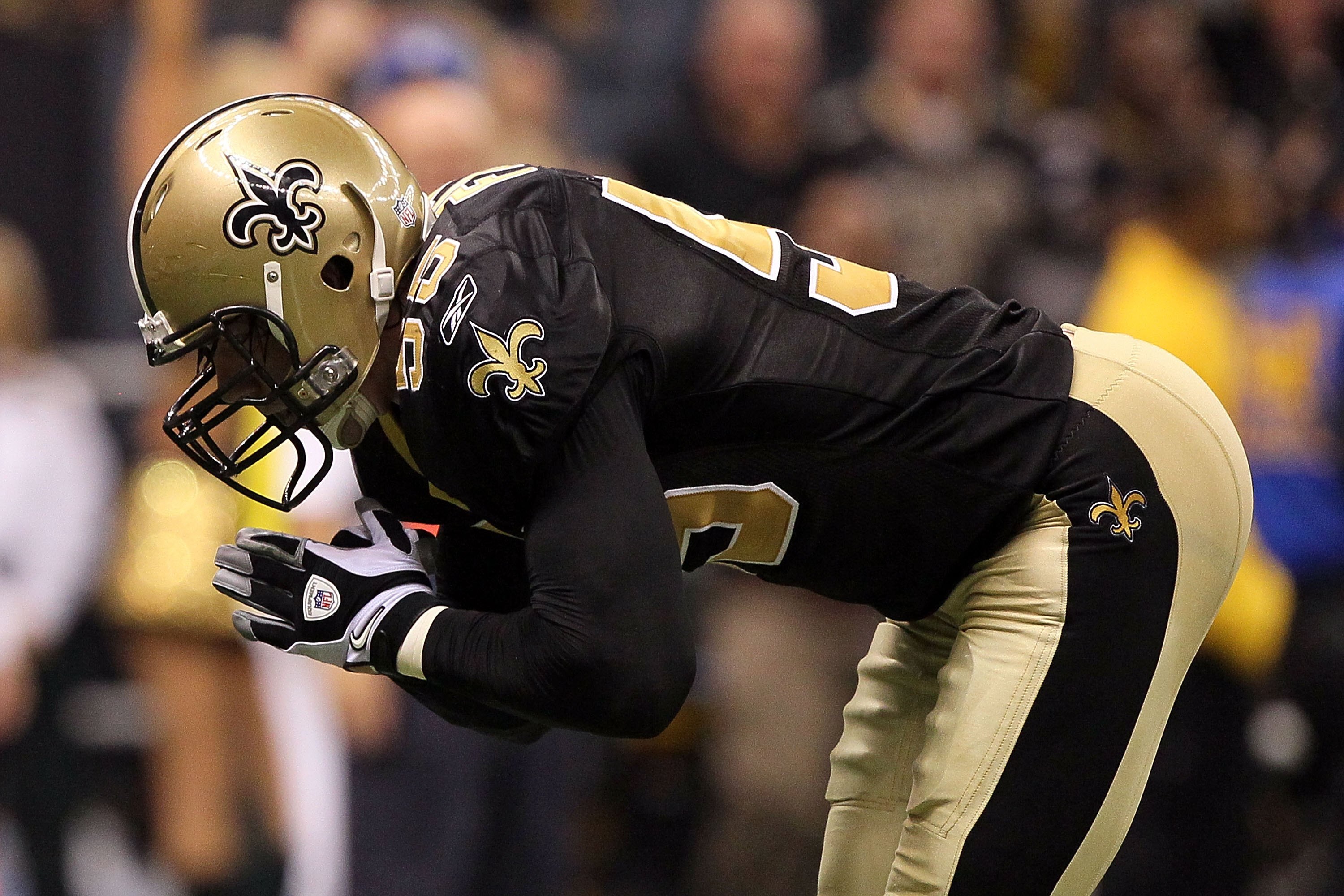 NEW ORLEANS - JANUARY 24:  Scott Fujita #55 of the New Orleans Saints bows as a gesture after a defensive stop against the Minnesota Vikings during the NFC Championship Game at the Louisiana Superdome on January 24, 2010 in New Orleans, Louisiana. The Sai