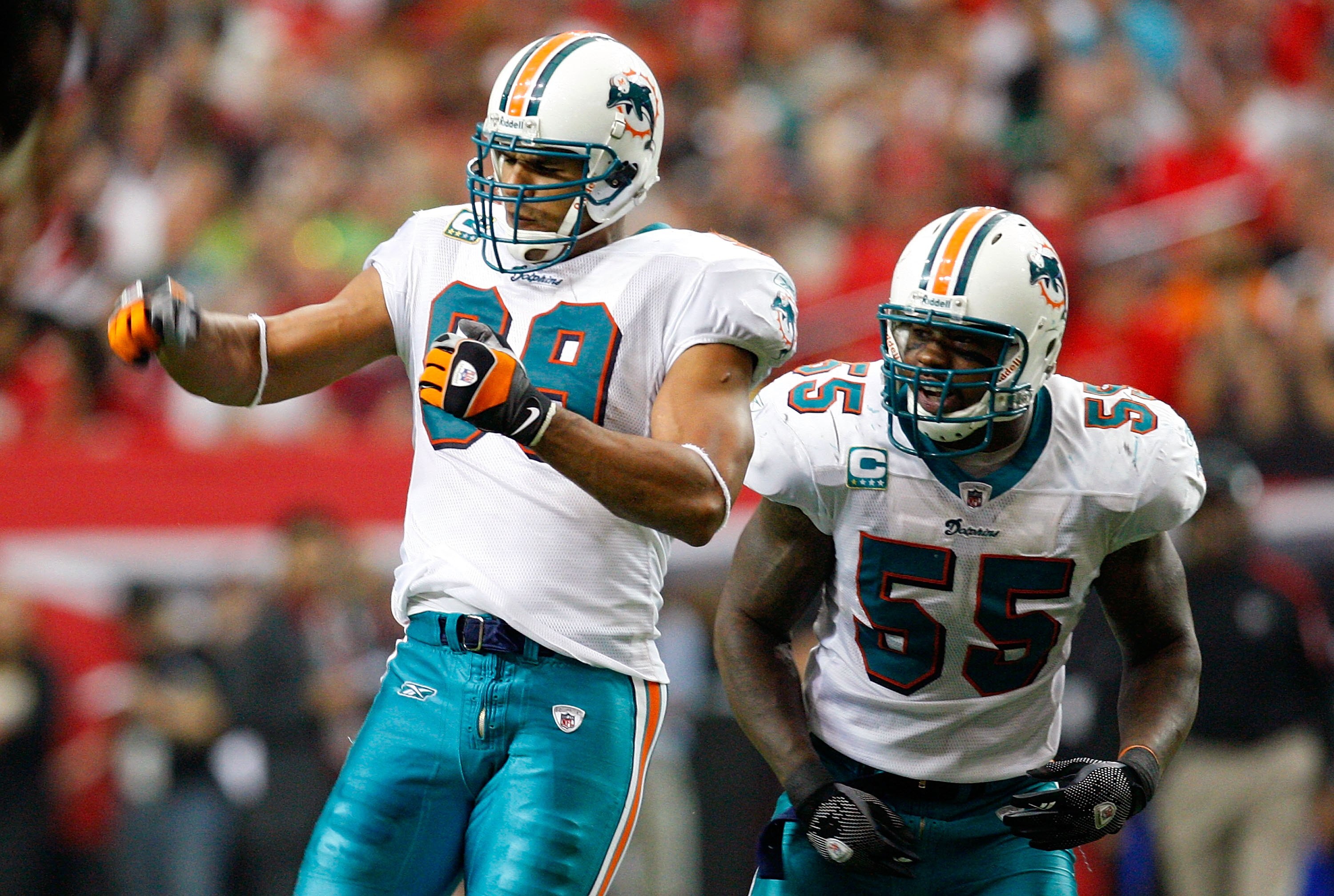 ATLANTA - SEPTEMBER 13:  Jason Taylor #99 and Joey Porter #55 of the Miami Dolphins against the Atlanta Falcons at Georgia Dome on September 13, 2009 in Atlanta, Georgia.  (Photo by Kevin C. Cox/Getty Images)