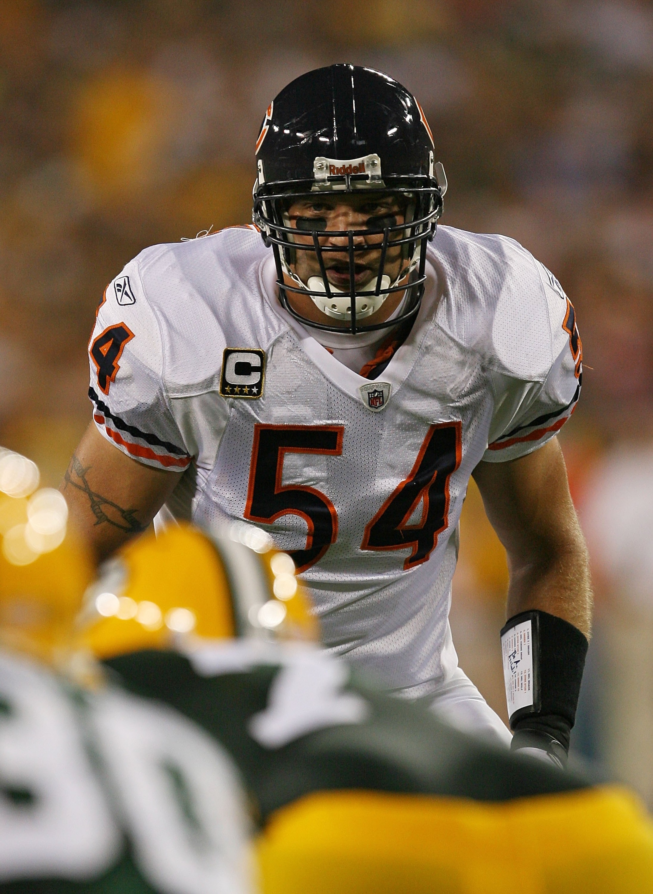 GREEN BAY, WI - SEPTEMBER 13: Brian Urlacher #54 of the Chicago Bears awaits the start of play in the 1st half against the Green Bay Packers on September 13, 2009 at Lambeau Field in Green Bay, Wisconsin. The Packers defeated the Bears 21-15. (Photo by Jo