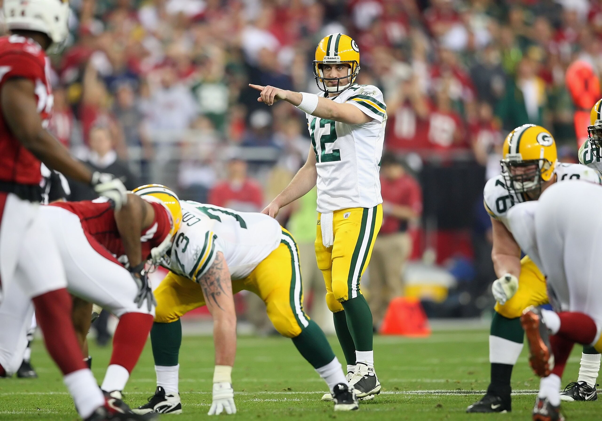 GLENDALE, AZ - JANUARY 10:  Quarterback Aaron Rodgers #12 of the Green Bay Packers drops back to pass during the 2010 NFC wild-card playoff game against the Arizona Cardinals at the Universtity of Phoenix Stadium on January 10, 2010 in Glendale, Arizona.