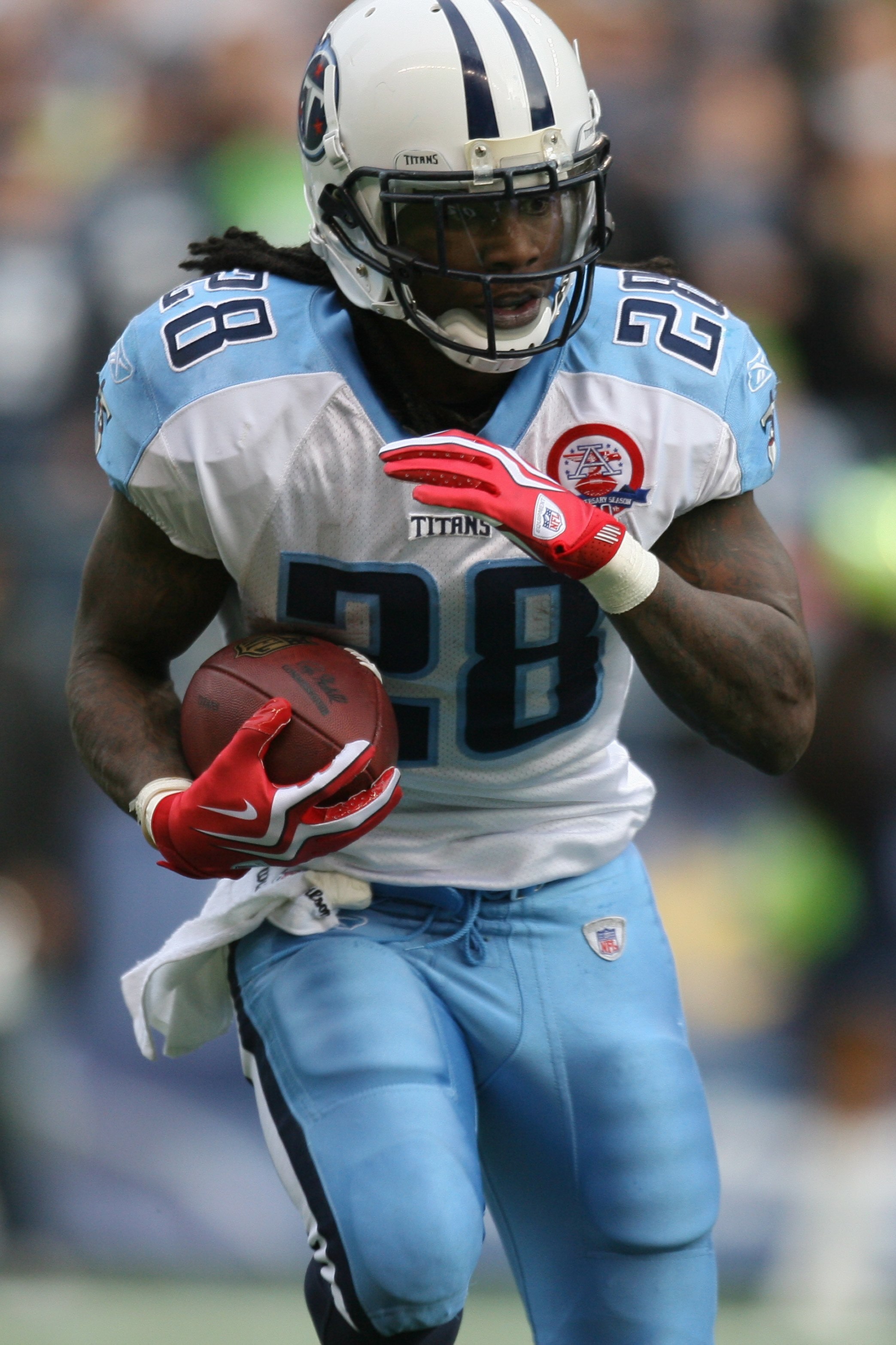 SEATTLE - JANUARY 03:  Chris Johnson #28 of the Tennessee Titans carries the ball during the game against the Seattle Seahawks on January 3, 2010 at Qwest Field in Seattle, Washington. (Photo by Otto Greule Jr/Getty Images)