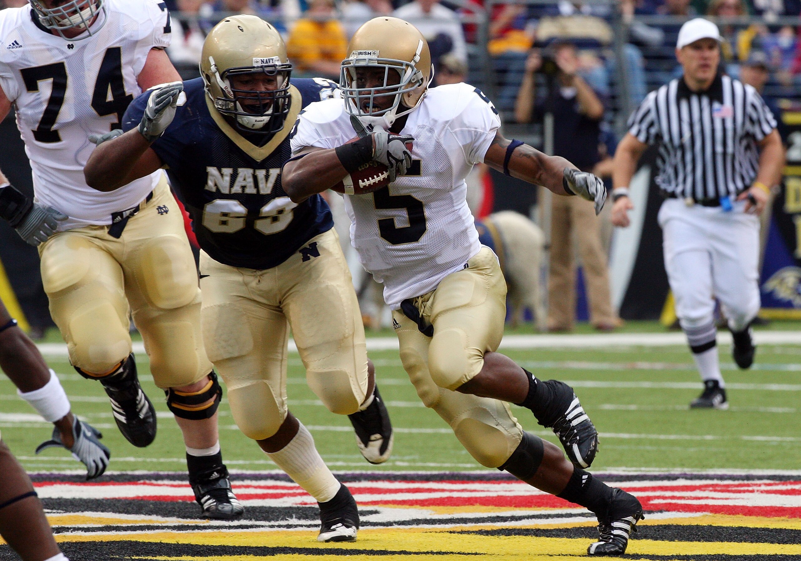 BALTIMORE - NOVEMBER 15:  Allen Armando #5 of the Notre Dame Fighting Irish runs the ball against Jordan Stephens #69 of the Navy Midshipmen on November 15, 2008 at M&T Bank Stadium in Baltimore, Maryland. Notre Dame defeated Navy 27-21.  (Photo by Jim Mc