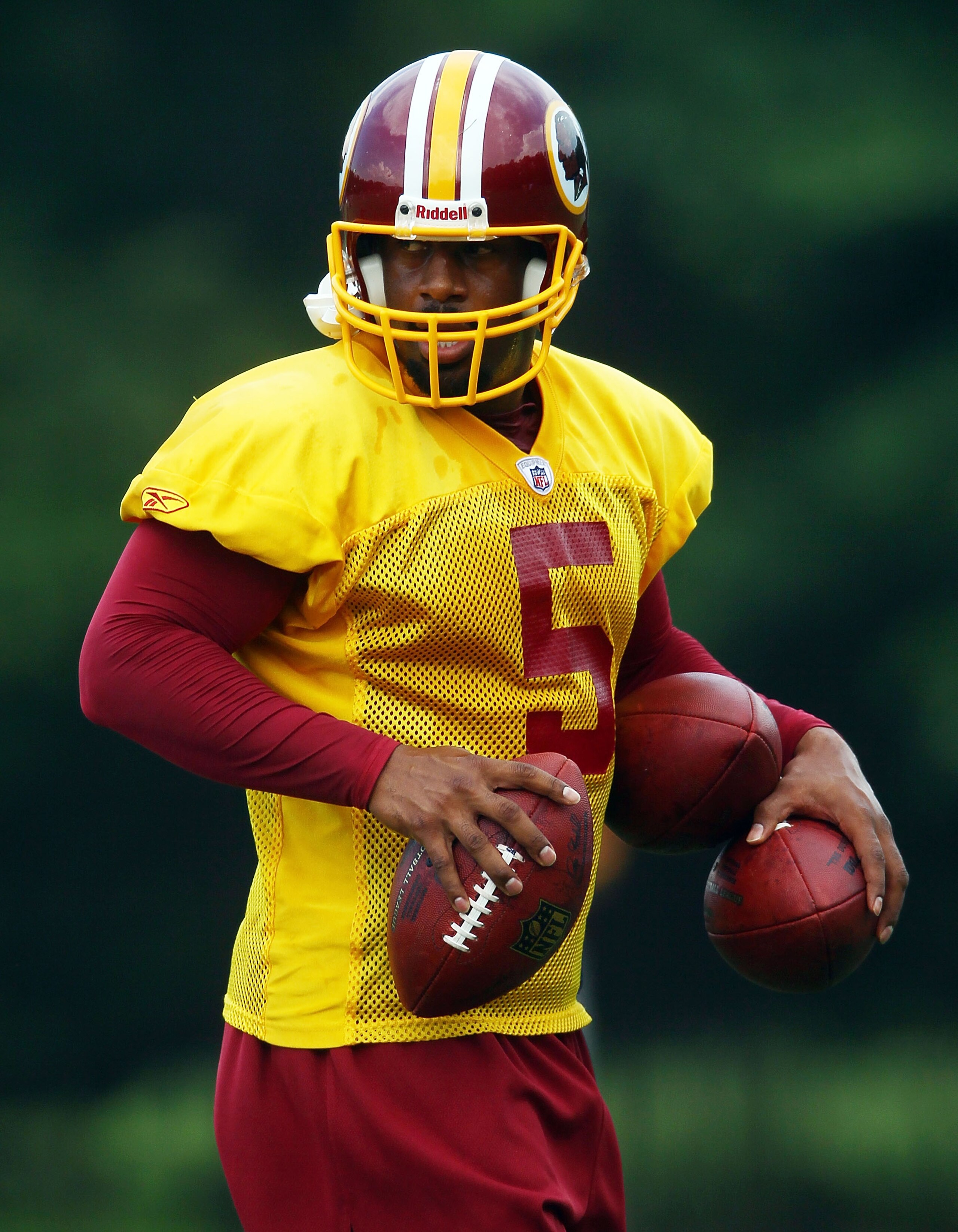 ASHBURN, VA - JULY 29: Quarterback Donovan McNabb #5 of the Washington Redskins participates in the first day of training camp July 29, 2010 in Ashburn, Virginia. (Photo by Win McNamee/Getty Images) ASHBURN, VA - JULY 29: Quarterback Donovan McNabb #5 of the Washington Redskins participates in the first day of training camp July 29, 2010 in Ashburn, Virginia. (Photo by Win McNamee/Getty Images)