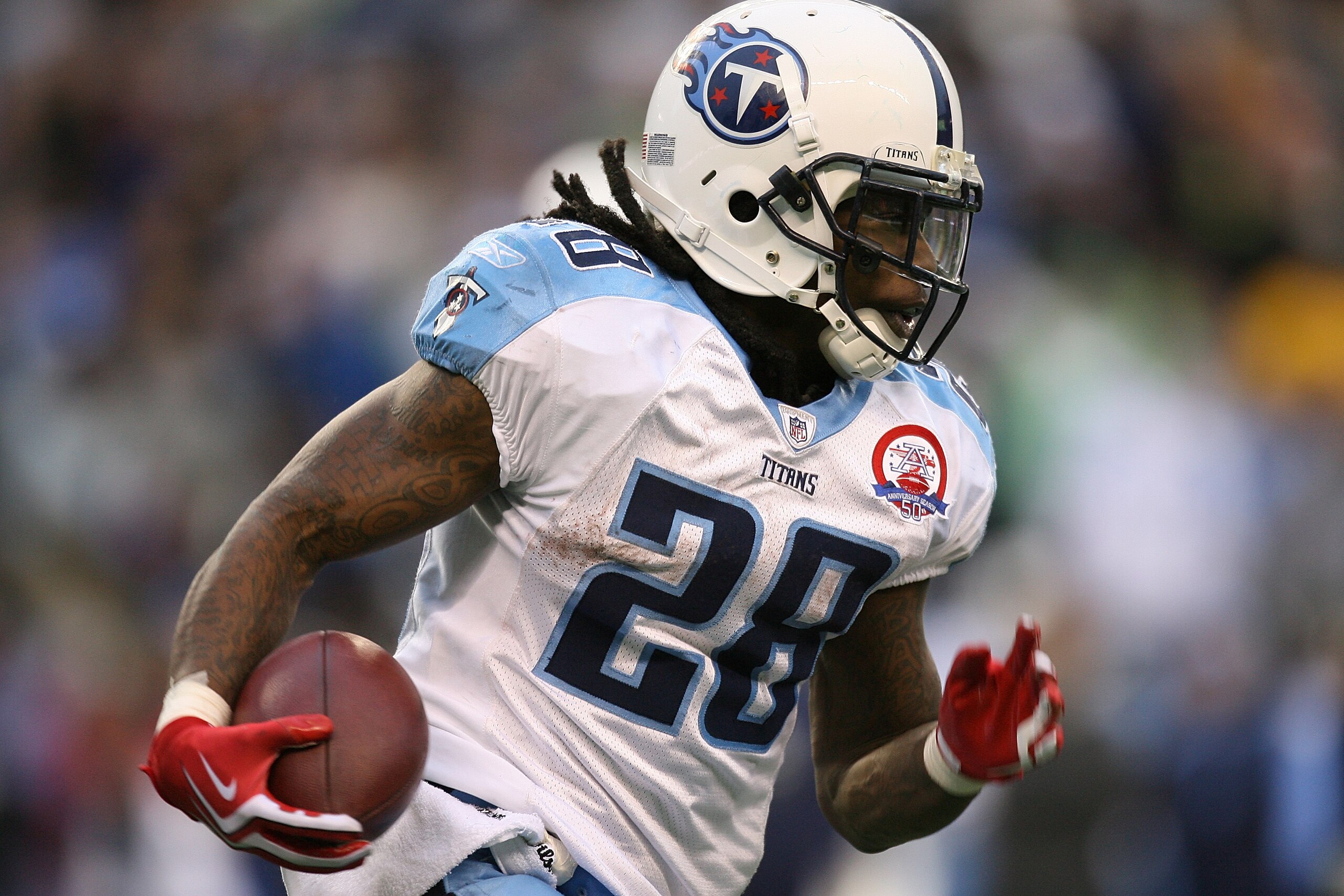 SEATTLE - JANUARY 03:  Running back Chris Johnson #28 of the Tennessee Titans rushes against the Seattle Seahawks on January 3, 2010 at Qwest Field in Seattle, Washington. The Titans defeated the Seahawks 17-13. (Photo by Otto Greule Jr/Getty Images)