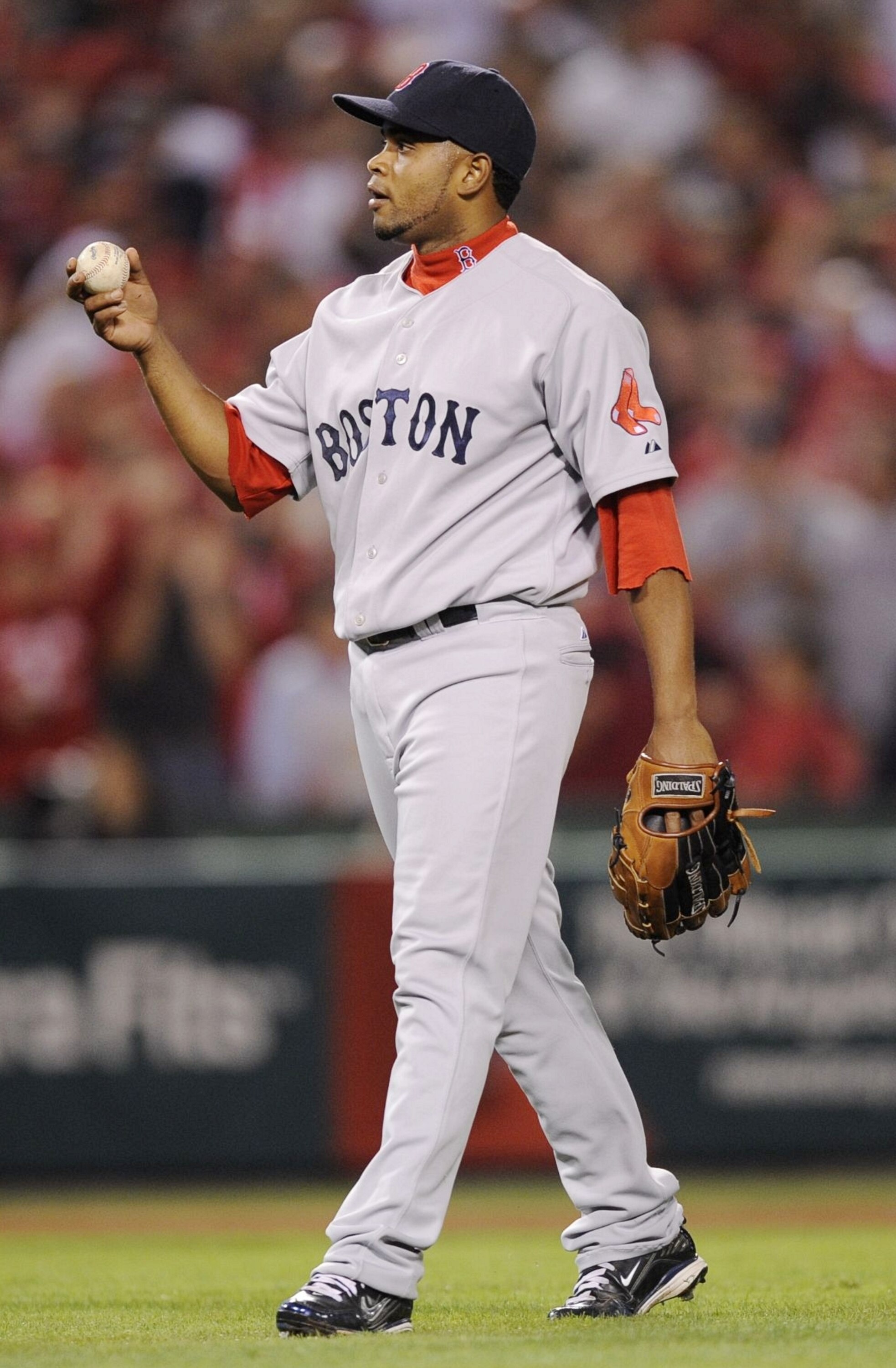 ANAHEIM, CA - OCTOBER 08:  Pitcher Ramon Ramirez #56 of the Boston Red Sox drops the ball on an infield hit by Vladimir Guerrero #27 of the Los Angeles Angels of Anaheim in the  seventh inning of Game One of the ALDS at Angel Stadium on October 8, 2009 in
