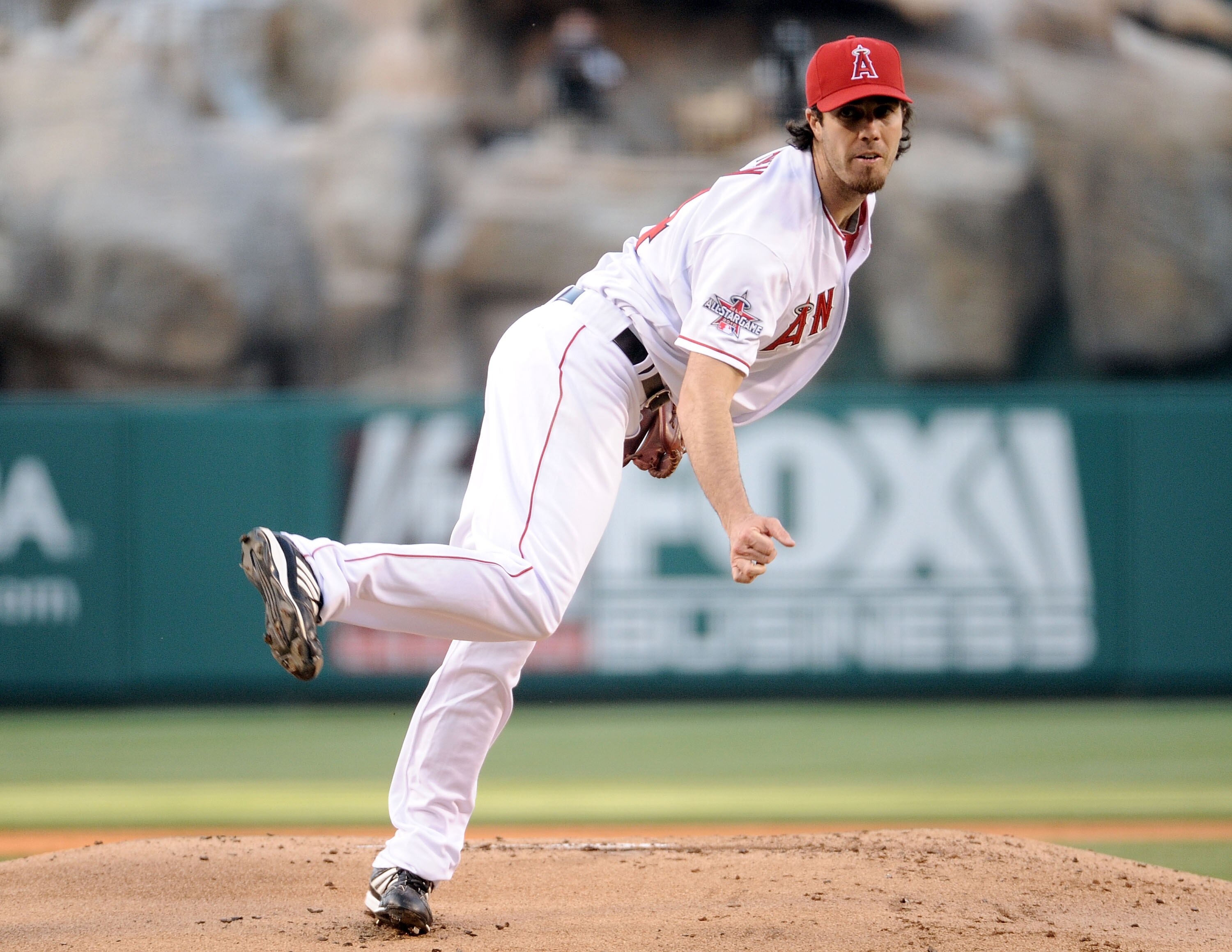 ANAHEIM, CA - JULY 26:  Dan Haren #24 of the  Los Angeles Angels pitches against the Boston Red Sox during the first inning at Angel Stadium on July 26, 2010 in Anaheim, California.  (Photo by Harry How/Getty Images)