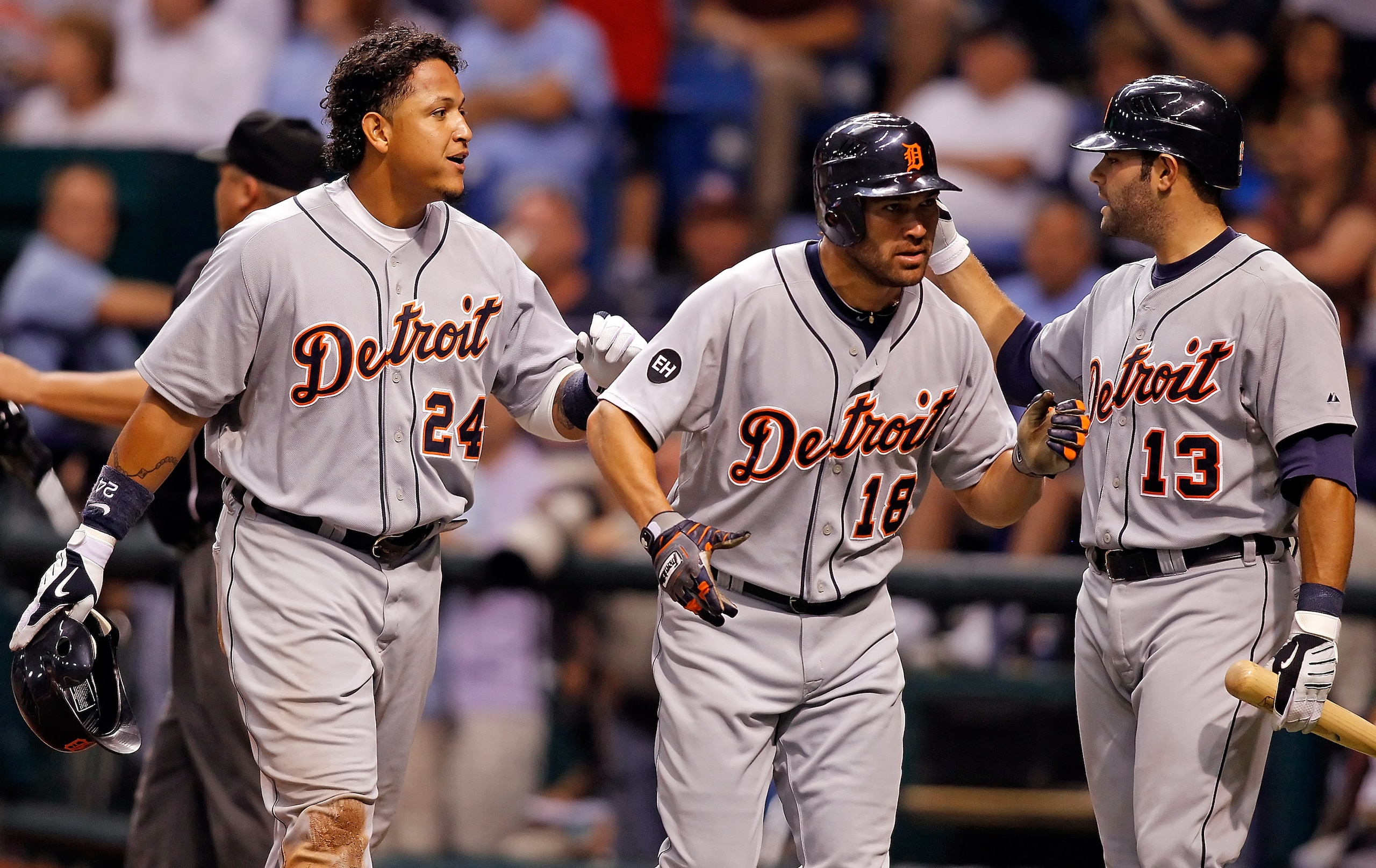 ST. PETERSBURG - JULY 27: Miguel Cabrera #24, Johnny Damon #18 and Alex Avila #13 of the Detroit Tigers celebrate just after Cabrera and Damon scored against the Tampa Bay Rays during the game at Tropicana Field on July 27, 2010 in St. Petersburg, Florid ST. PETERSBURG - JULY 27: Miguel Cabrera #24, Johnny Damon #18 and Alex Avila #13 of the Detroit Tigers celebrate just after Cabrera and Damon scored against the Tampa Bay Rays during the game at Tropicana Field on July 27, 2010 in St. Petersburg, Florid