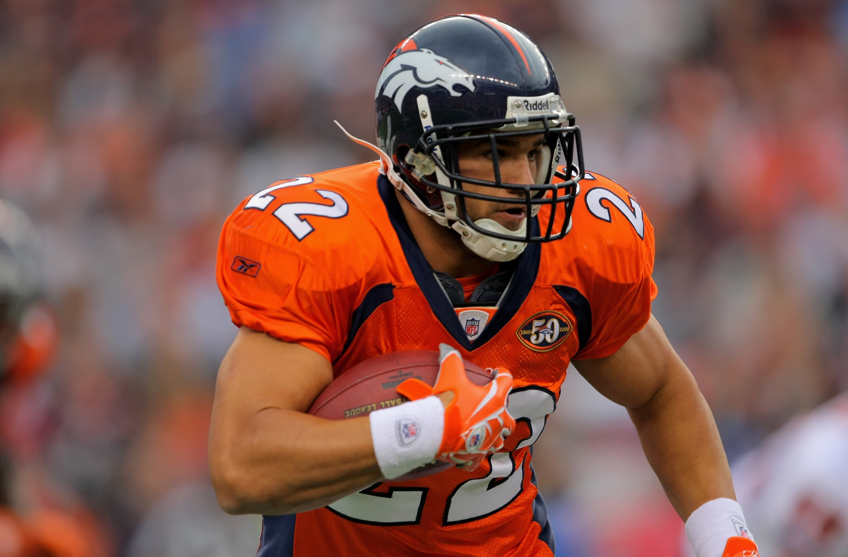 DENVER - AUGUST 30:  Running back Peyton Hillis #22 of the Denver Broncos rushes against the Chicago Bears during preseason NFL action at INVESCO Field at Mile High on August 30, 2009 in Denver, Colorado. The Bears defeated the Broncos 27-17.  (Photo by D
