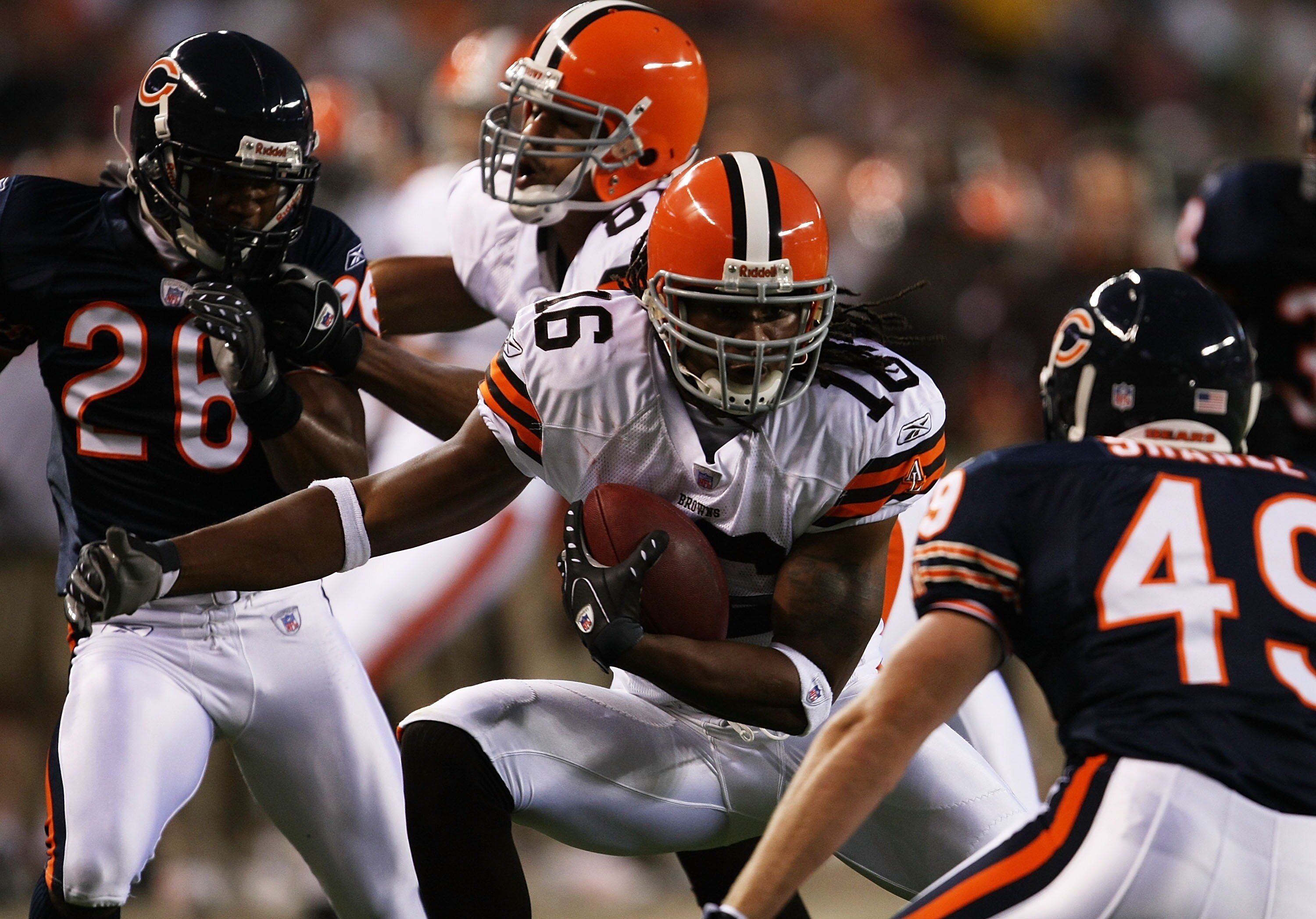 CHICAGO - AUGUST 30: Joshua Cribbs #16 of the Cleveland Browns runs for a first down after catching a pass as Andrew Shanle #49 of the Chicago Bears closes in for the tackle in a preseason game at Soldier Field August 30, 2007 in Chicago, Illinois. (Photo