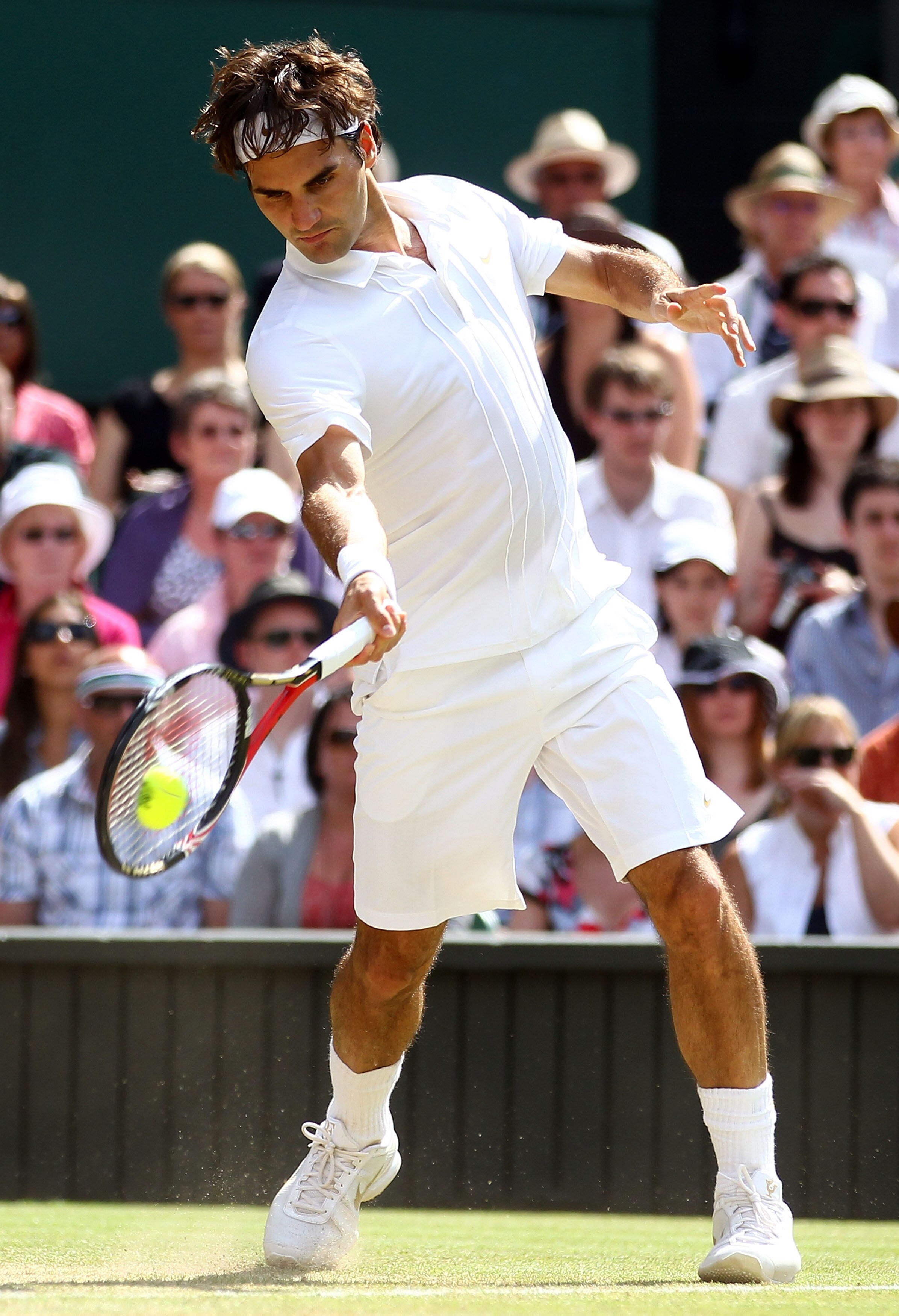 LONDON, ENGLAND - JUNE 30:  Roger Federer of Switzerland plays a shot during his Quarter Final match against Tomas Berdych of Czech Republic on Day Nine of the Wimbledon Lawn Tennis Championships at the All England Lawn Tennis and Croquet Club on June 30,