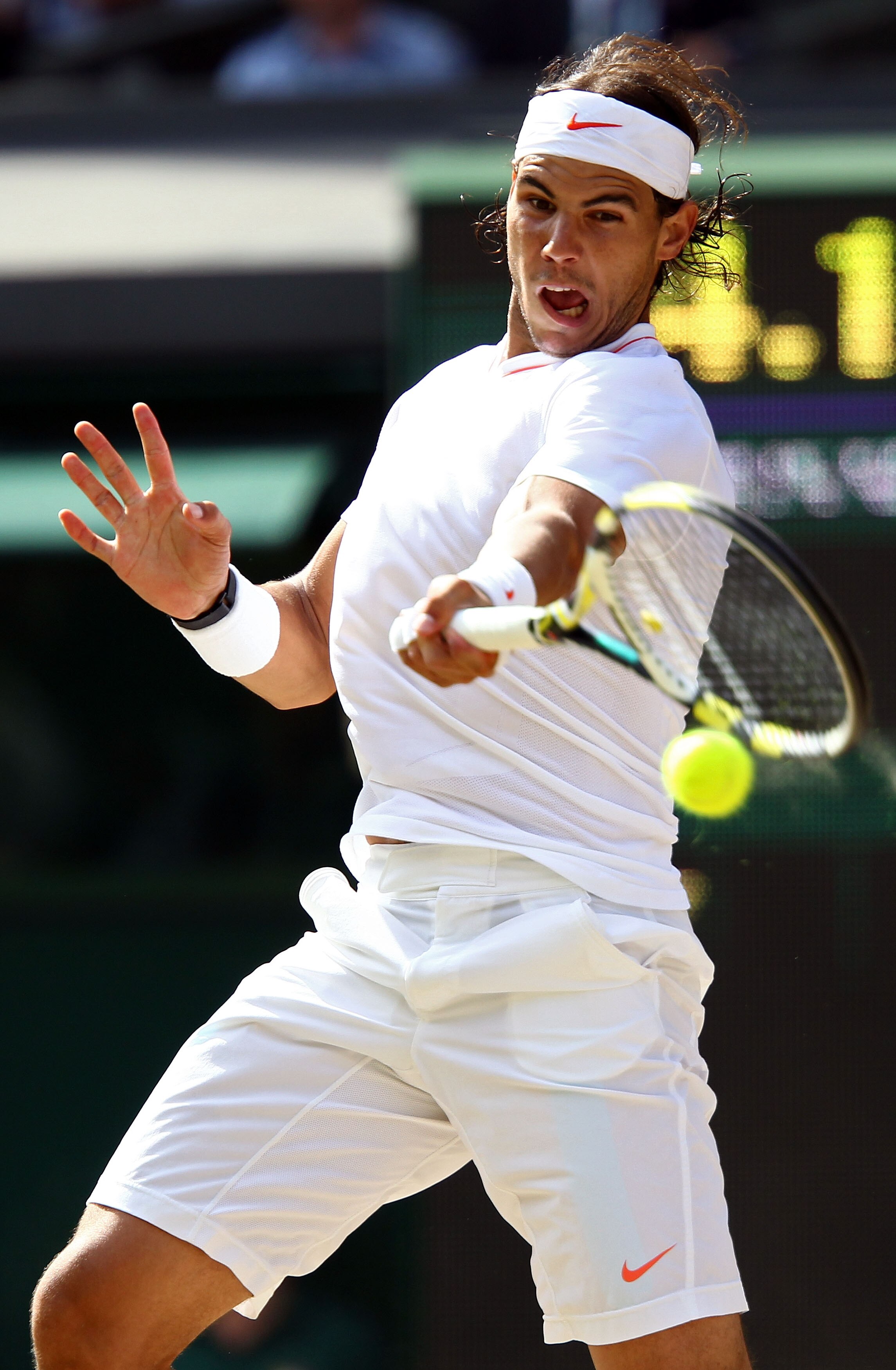 LONDON, ENGLAND - JULY 04:  Rafael Nadal of Spain plays a shot during the Men's Singles Final match against Tomas Berdych of Czech Republic on Day Thirteen of the Wimbledon Lawn Tennis Championships at the All England Lawn Tennis and Croquet Club on July 