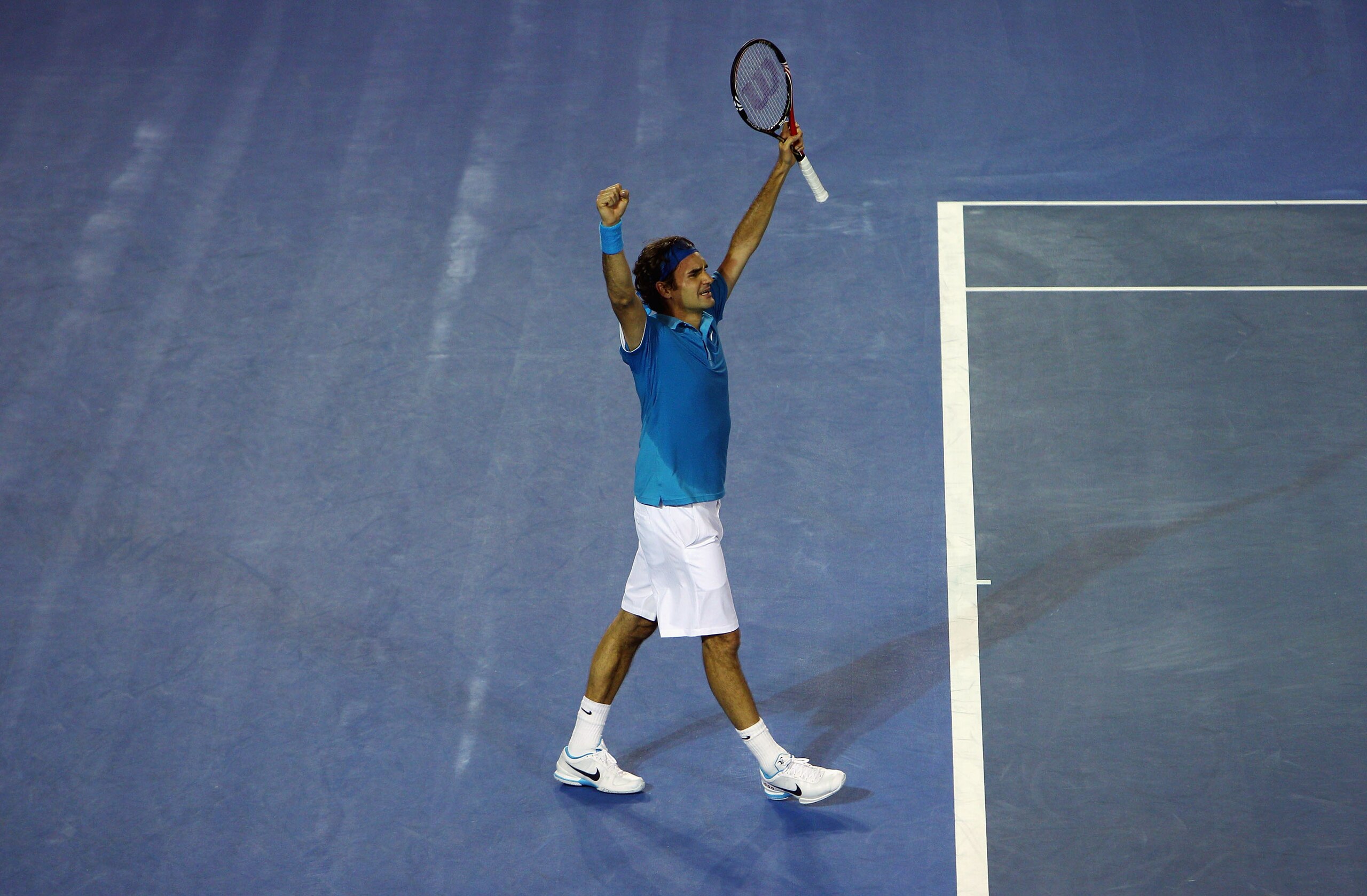 MELBOURNE, AUSTRALIA - JANUARY 31:  Roger Federer of Switzerland celebrates championship point in his men's final match against Andy Murray of Great Britain during day fourteen of the 2010 Australian Open at Melbourne Park on January 31, 2010 in Melbourne