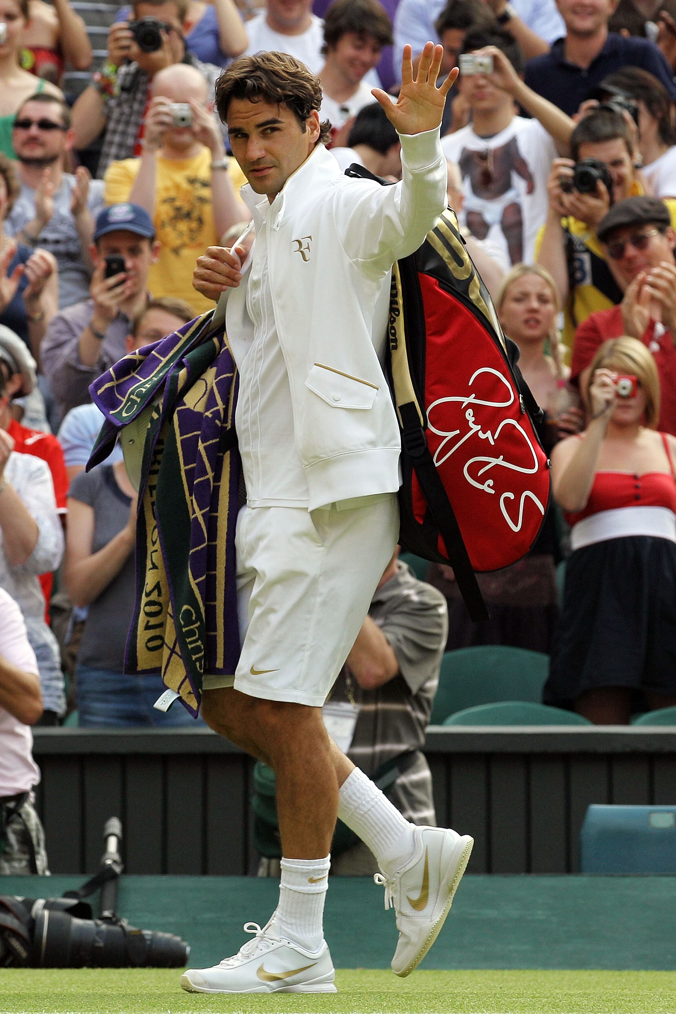 LONDON, ENGLAND - JUNE 25:  Roger Federer of Switzerland exits after winning his match against Arnaud Clement of France on Day Five of the Wimbledon Lawn Tennis Championships at the All England Lawn Tennis and Croquet Club on June 25, 2010 in London, Engl