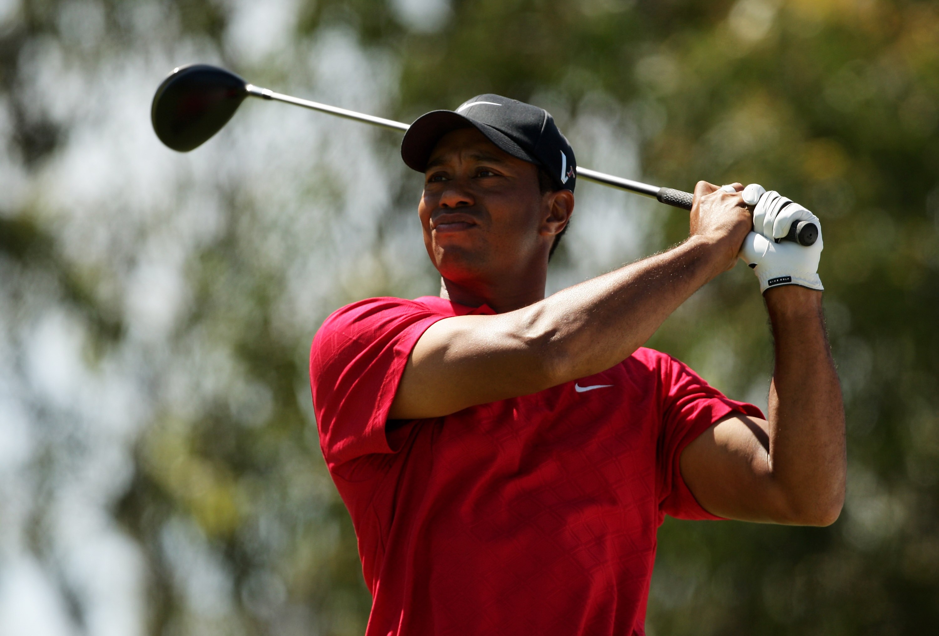 MELBOURNE, AUSTRALIA - NOVEMBER 15:  Tiger Woods of the USA tees off on the 12th hole during the final round of the 2009 Australian Masters at Kingston Heath Golf Club on November 15, 2009 in Melbourne, Australia.  (Photo by Mark Dadswell/Getty Images)