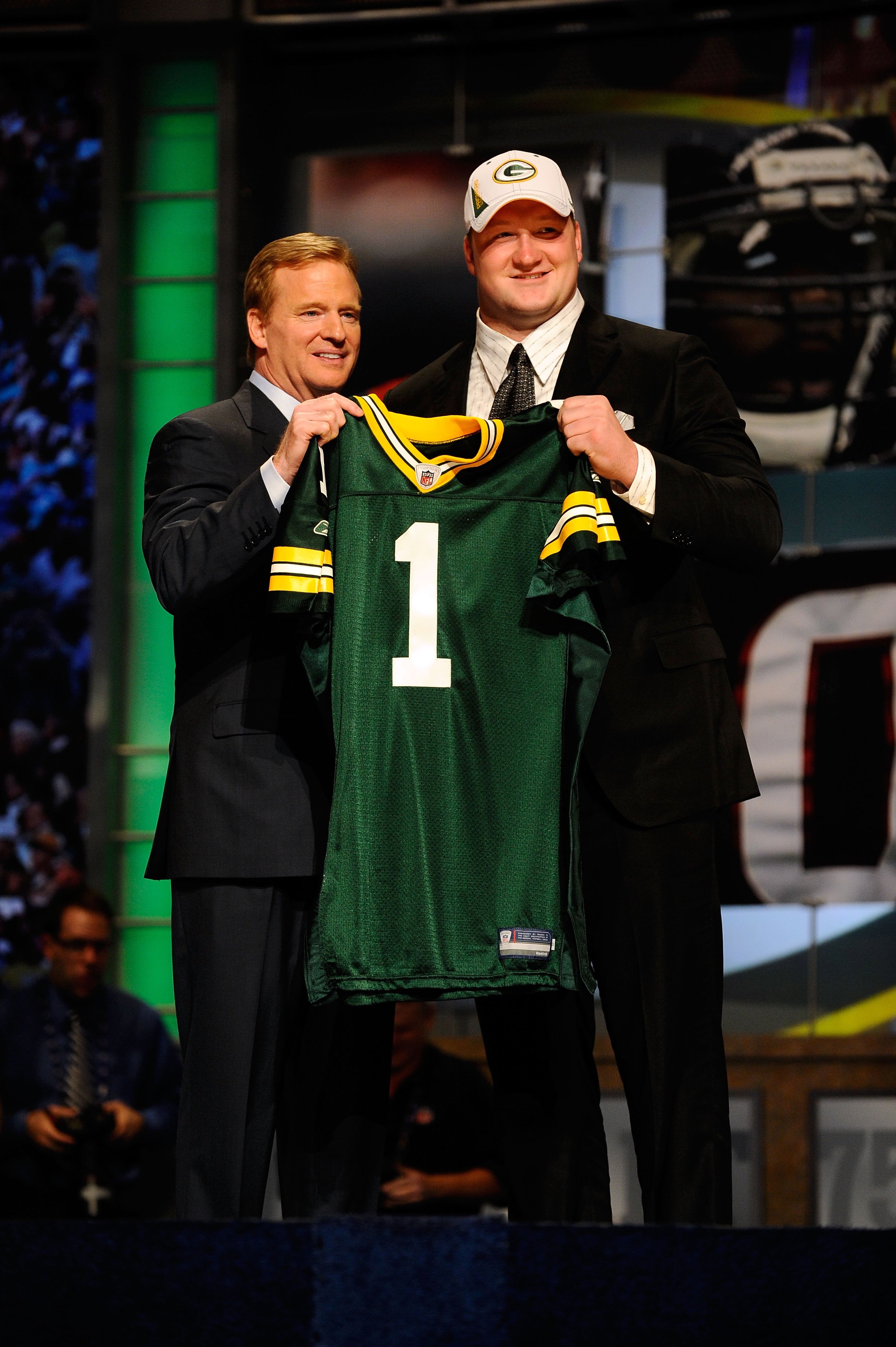 NEW YORK - APRIL 22:  Bryan Bulaga from the Iowa Hawkeyes poses with NFL Commissioner Roger Goodell as they hold up a Green Bay Packers jersey after the Packers drafted Bulaga number 23 overall during the first round of the 2010 NFL Draft at Radio City Mu