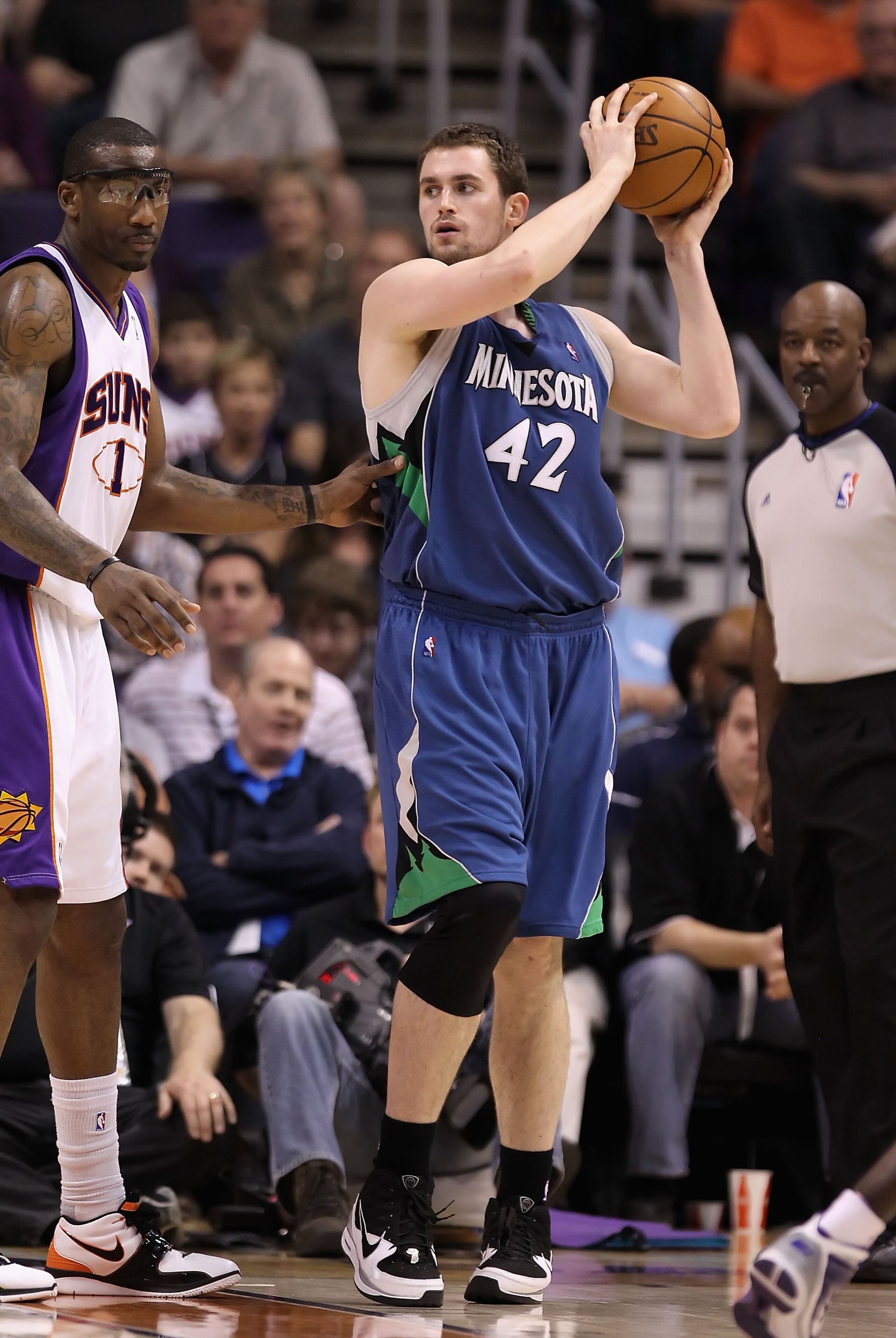PHOENIX - MARCH 16:  Kevin Love #42 of the Minnesota Timberwolves looks to pass the ball during the NBA game against the Phoenix Suns at US Airways Center on March 16, 2010 in Phoenix, Arizona. The Suns defeated the Timberwolves 152-114.  NOTE TO USER: Us