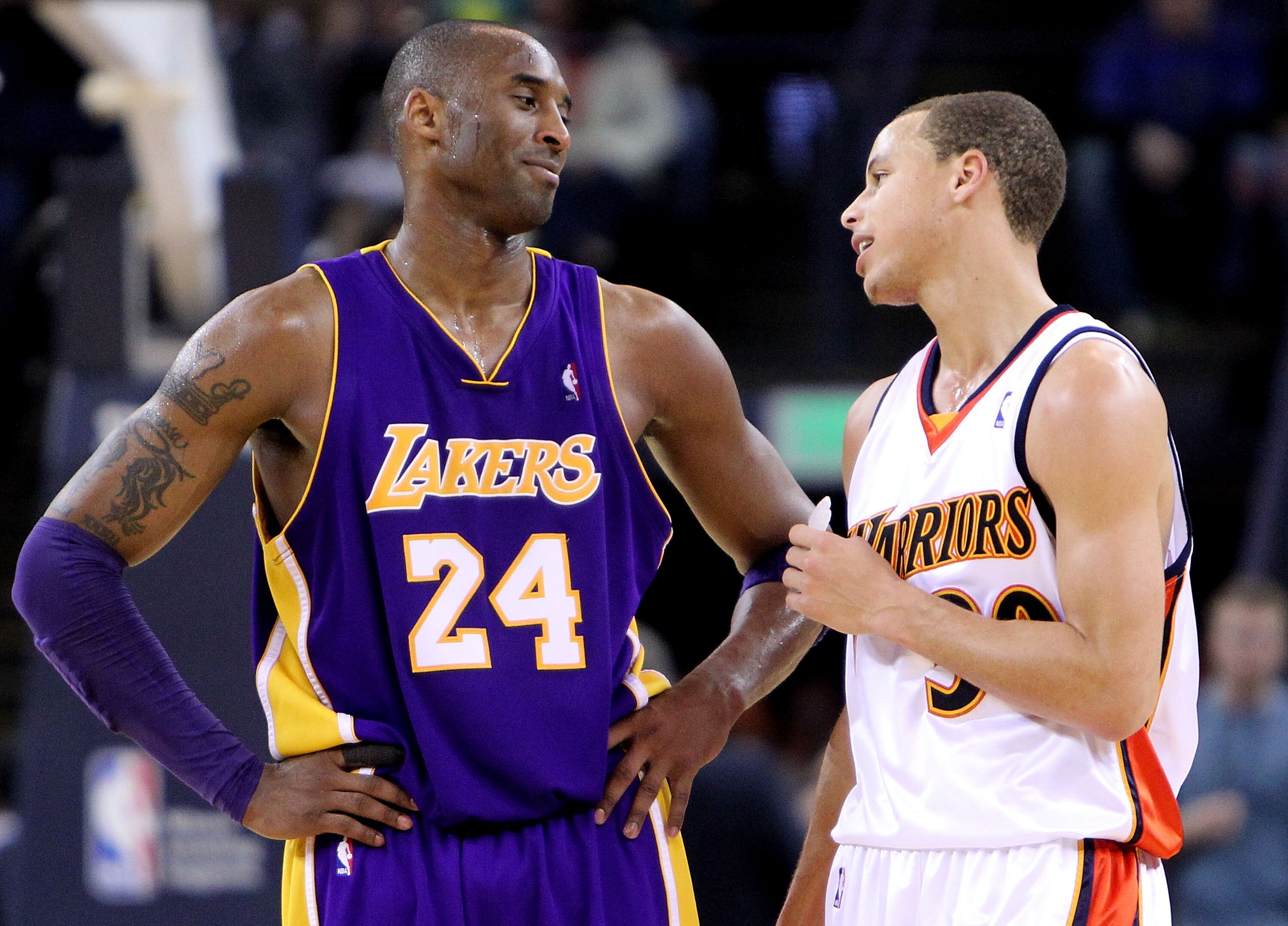 OAKLAND, CA - MARCH 15:  Kobe Bryant #24 of the Los Angeles Lakers jokes with Stephen Curry #30 of the Golden State Warriors during an NBA game at Oracle Arena on March 15, 2010 in Oakland, California. NOTE TO USER: User expressly acknowledges and agrees