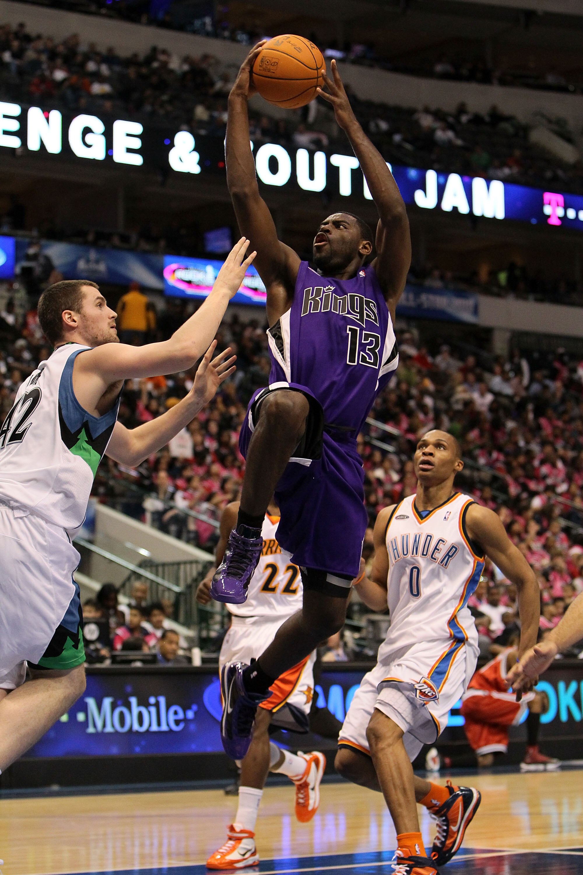 DALLAS - FEBRUARY 12:  Tyreke Evans #13 of the Rookie team shoots against Kevin Love #42 and Russell Westbrook #0 of the Sophomore team during the second half of the T-Mobile Rookie Challenge & Youth Jam part of 2010 NBA All-Star Weekend at American Airli