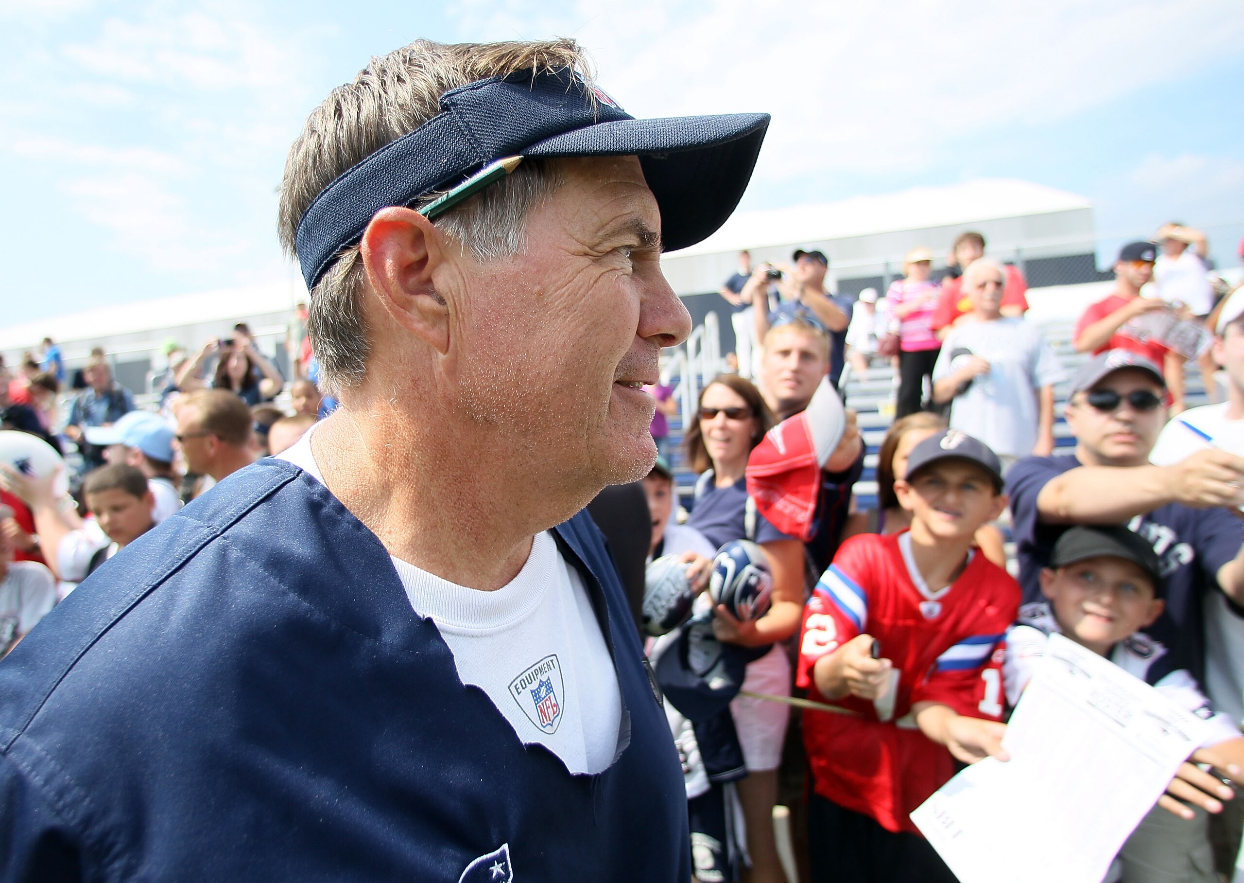 FOXBORO, MA - AUGUST 02:  Head coach Bill Belichick of the New England Patriots signs autographs after training camp on August 2, 2010 at Gillette Stadium in Foxboro, Massachusetts.  (Photo by Elsa/Getty Images)