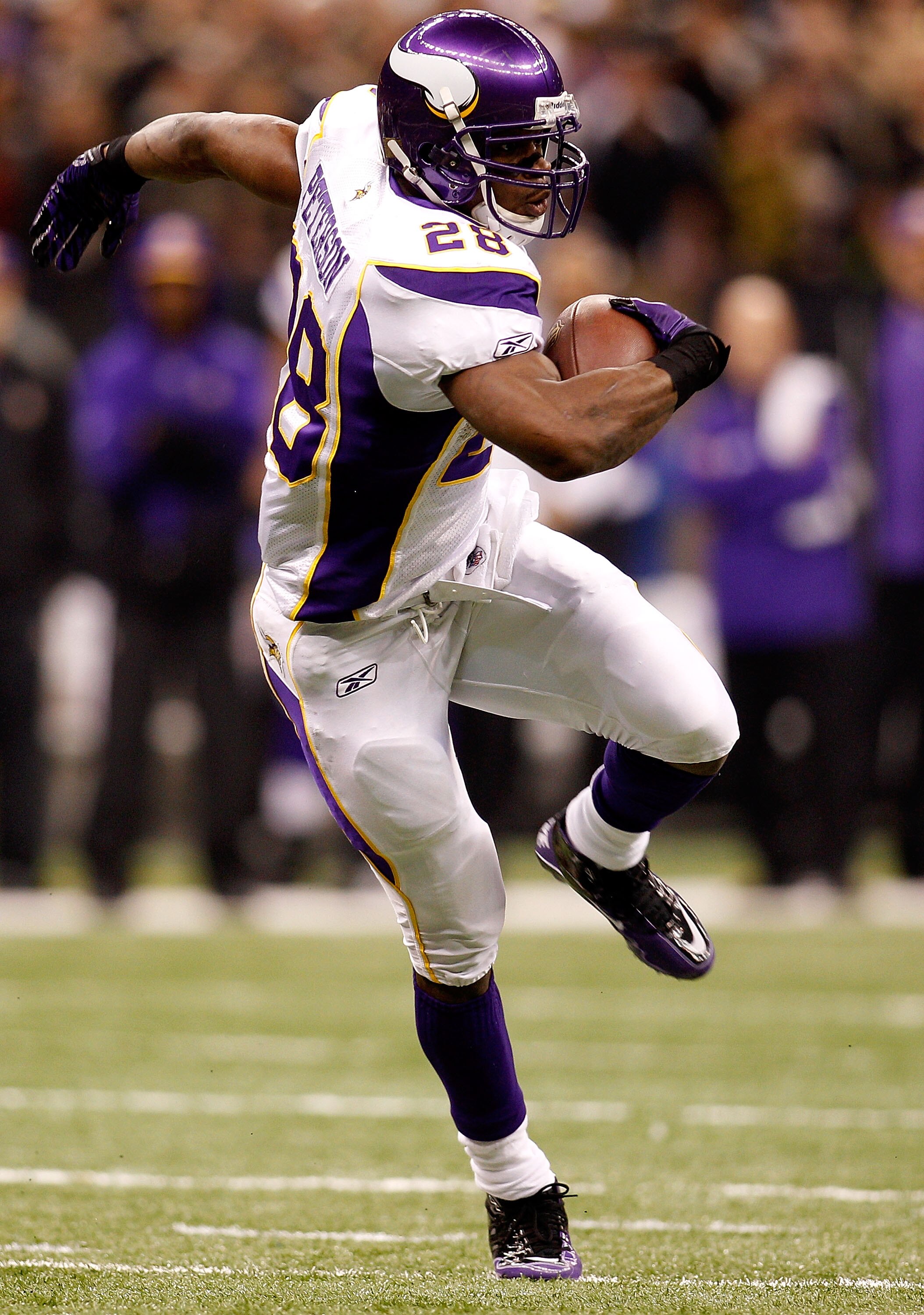NEW ORLEANS - JANUARY 24:  Adrian Peterson #28 of the Minnesota Vikings runs for a 19-yard touchdown in the first quarter against the New Orleans Saints during the NFC Championship Game at the Louisana Superdome on January 24, 2010 in New Orleans, Louisia