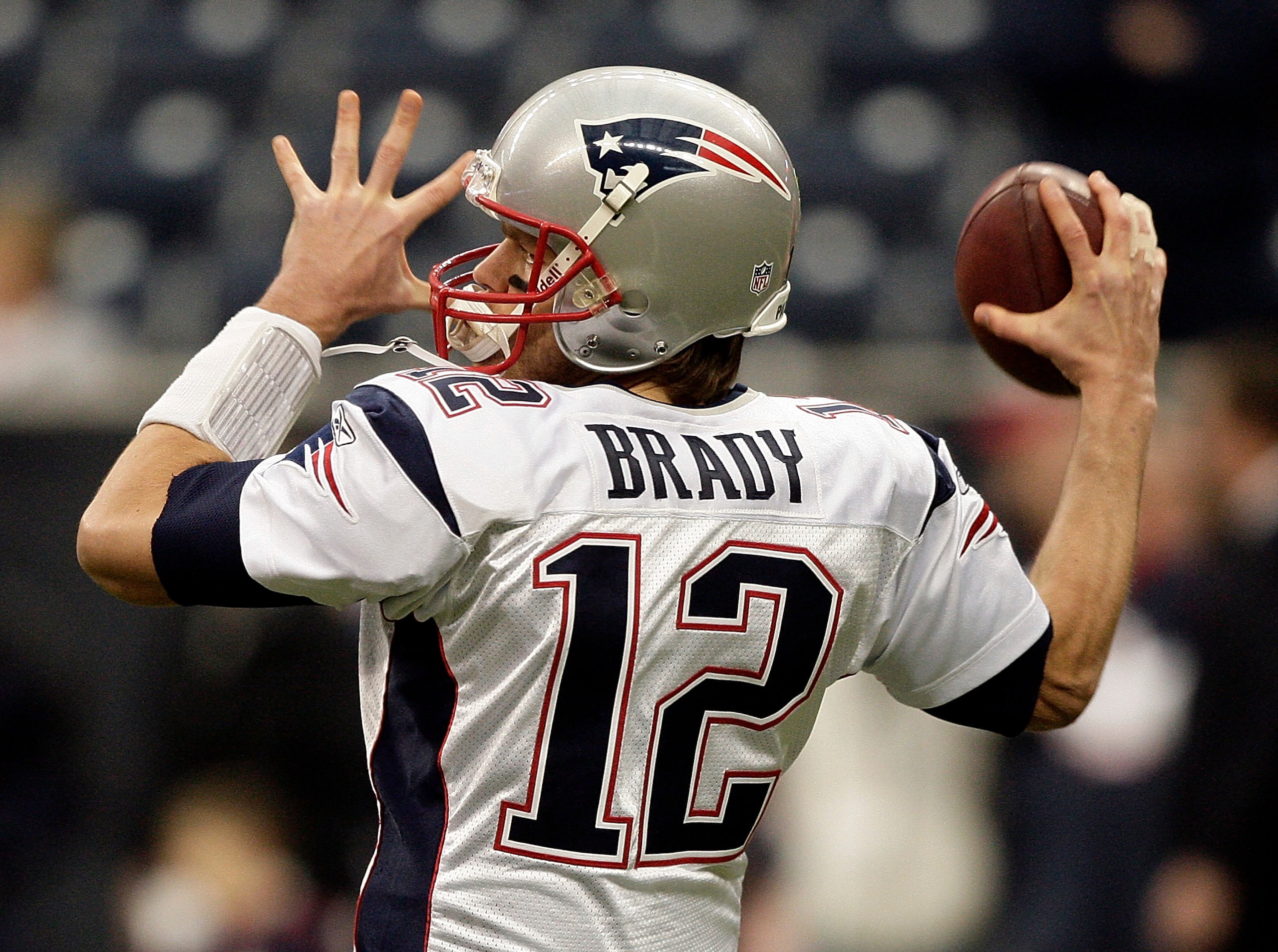 HOUSTON - JANUARY 03:  Quarterback Tom Brady #12 of the New England Patriots warms up before playing the Houston Texans at Reliant Stadium on January 3, 2010 in Houston, Texas.  (Photo by Bob Levey/Getty Images)