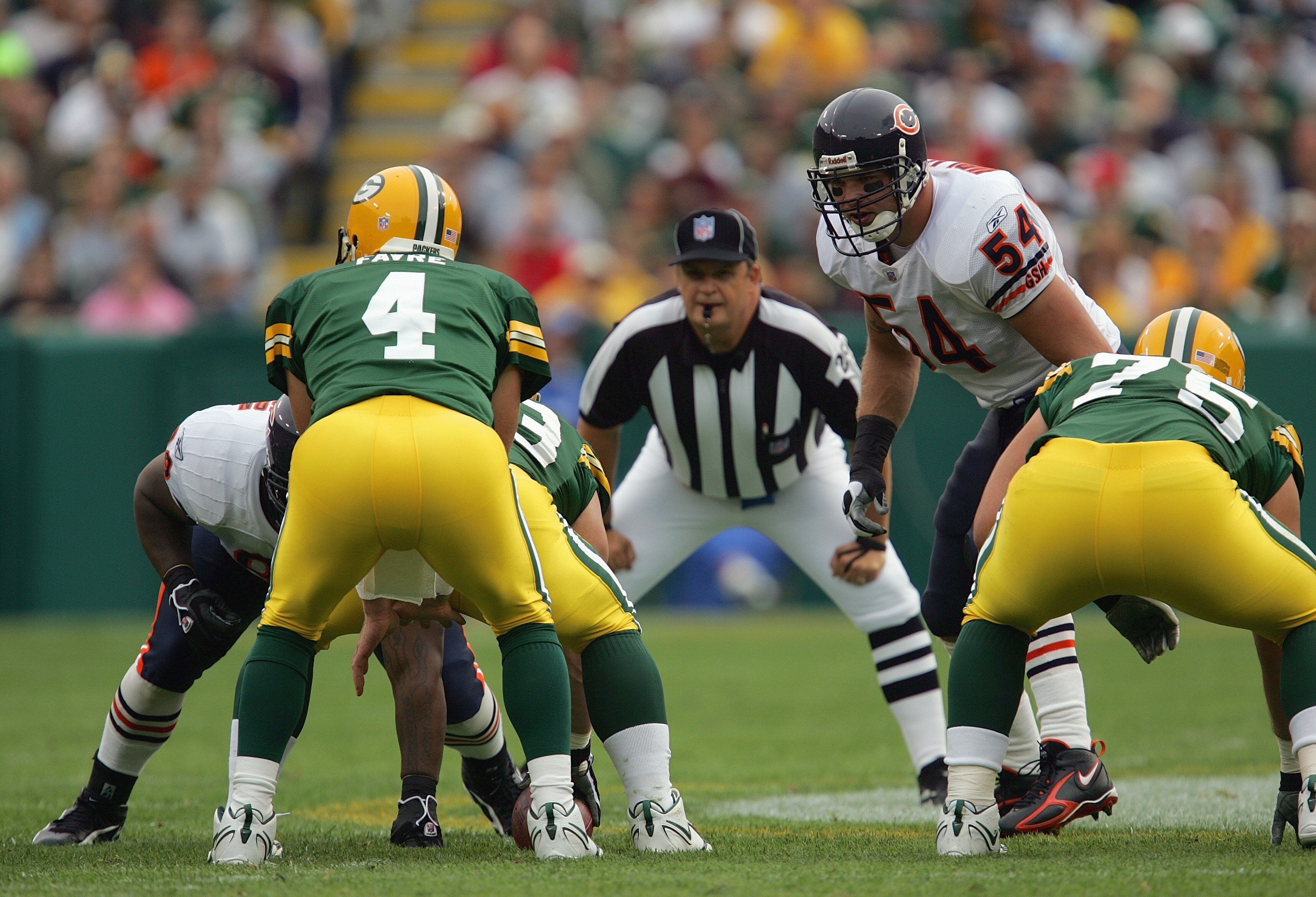GREEN BAY, WI - SEPTEMBER 10:  Linebacker Brian Urlacher #54 of the Chicago Bears lines up at the line of scrimmage and watches quarterback Brett Favre #4 of the Green Bay Packers prior to the snap of the ball during their game on September 10, 2006 at La