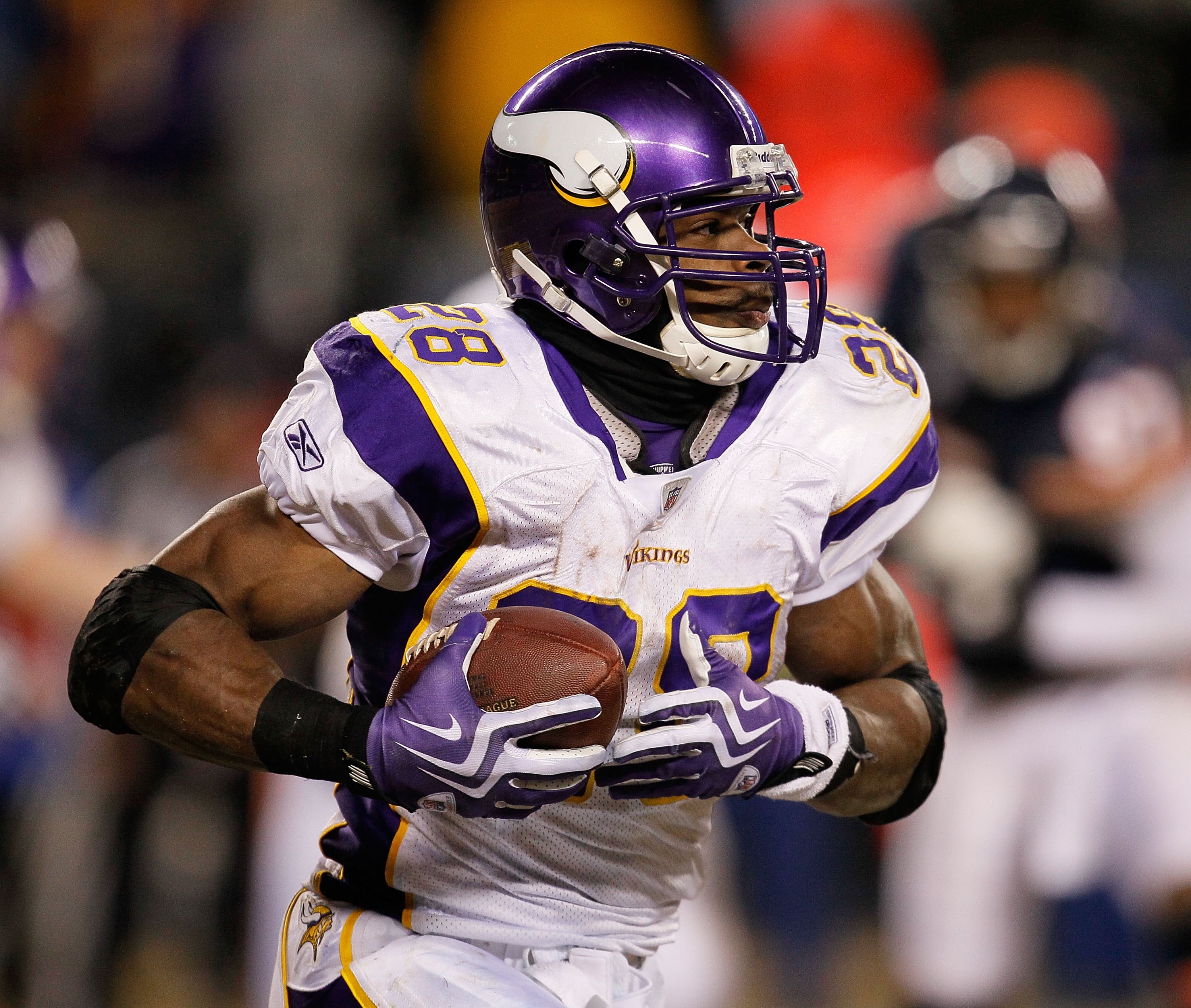 CHICAGO - DECEMBER 28: Adrian Peterson #28 of the Minnesota Vikings runs against the Chicago Bears at Soldier Field on December 28, 2009 in Chicago, Illinois. The Bears defeated the Vikings 36-30 in overtime.  (Photo by Jonathan Daniel/Getty Images)