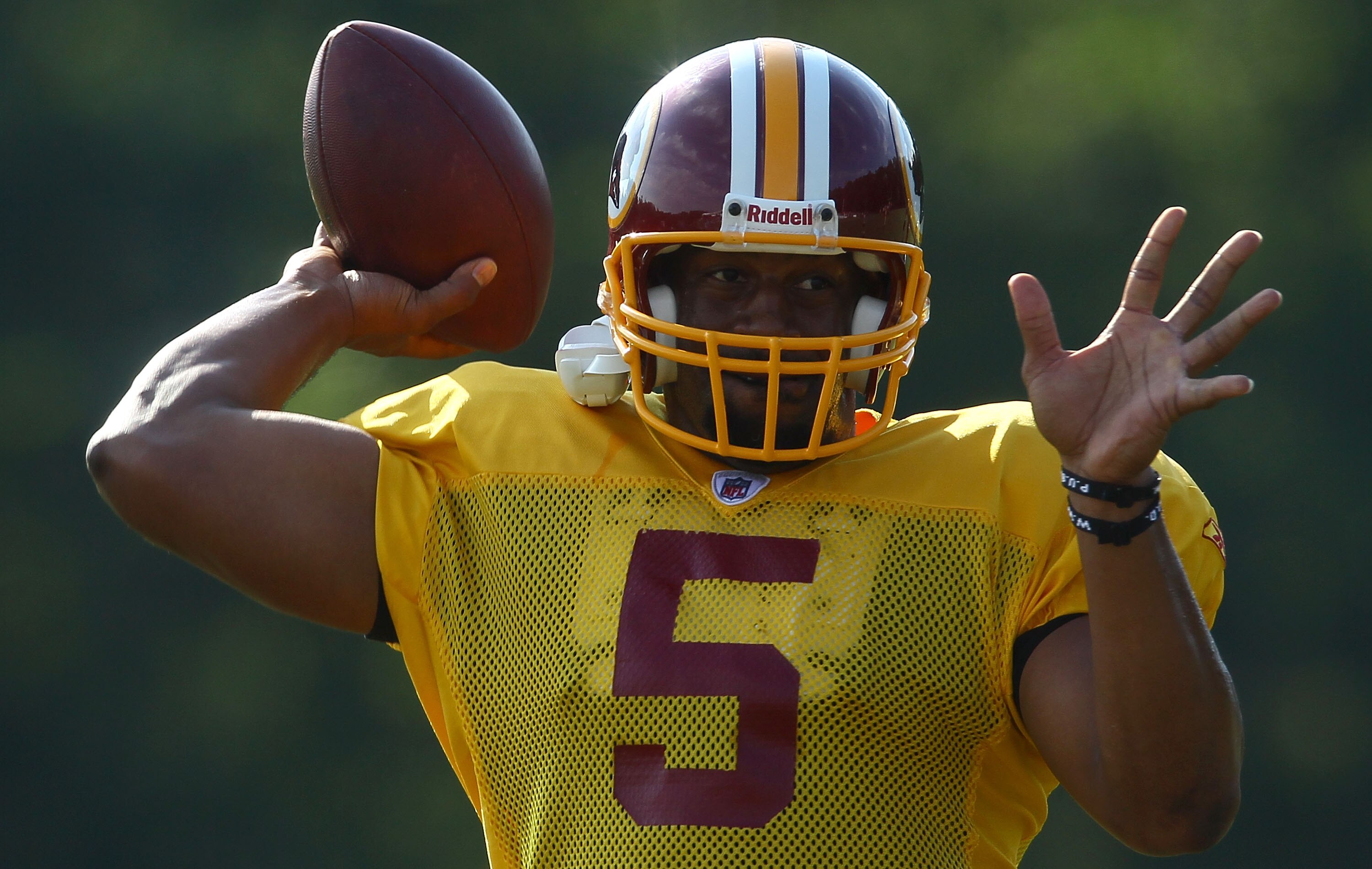 ASHBURN, VA - JULY 30:  Quarterback Donovan McNabb #5 of the Washington Redskins throws a pass during the second day of training camp July 30, 2010 in Ashburn, Virginia.  (Photo by Win McNamee/Getty Images)