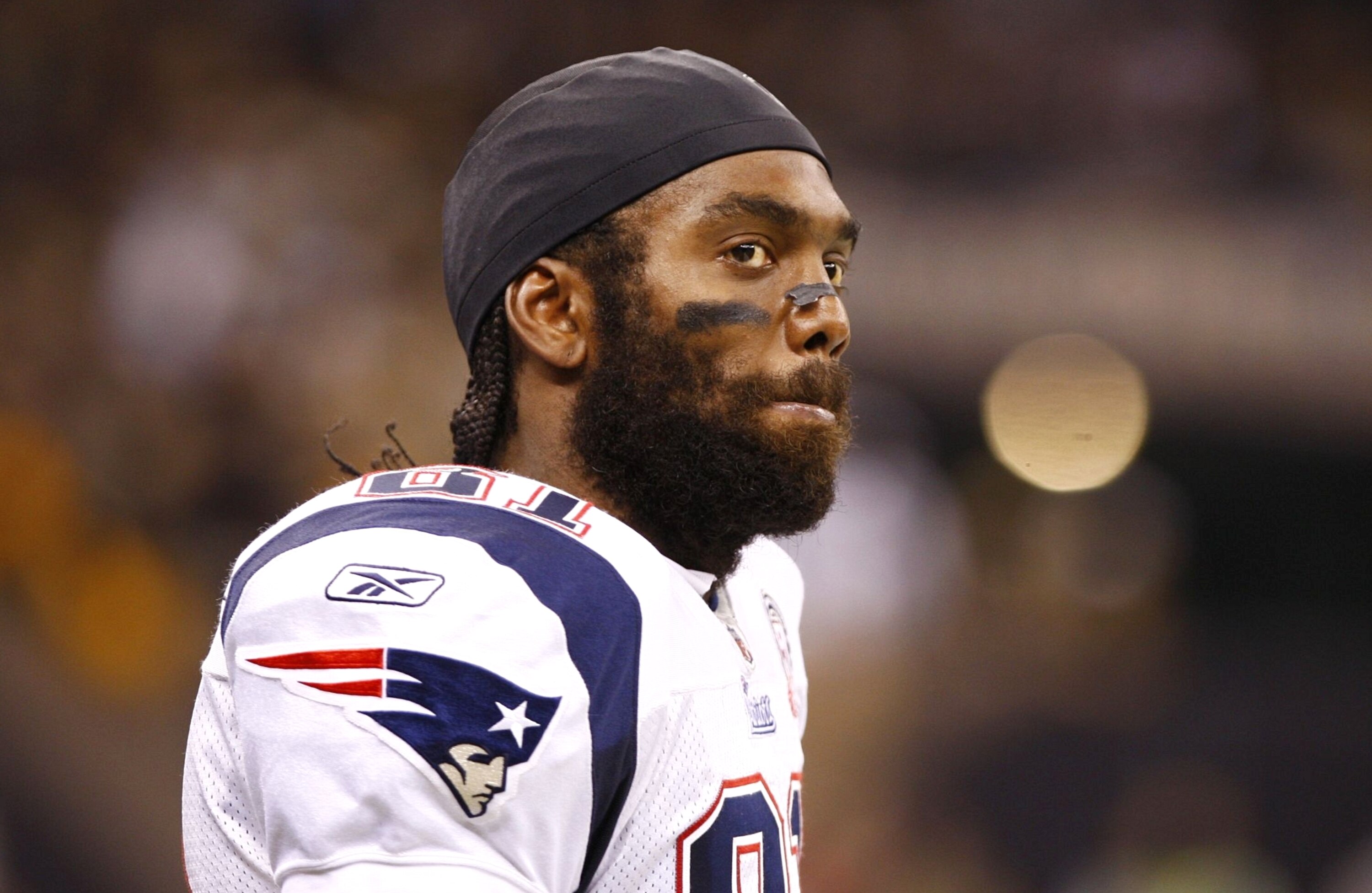 NEW ORLEANS - NOVEMBER 30: Randy Moss #81 of the New England Patriots looks on from the sideline in the fourth quarter against the New Orleans Saints at Louisana Superdome on November 30, 2009 in New Orleans, Louisiana. (Photo by Scott Halleran/Getty Imag