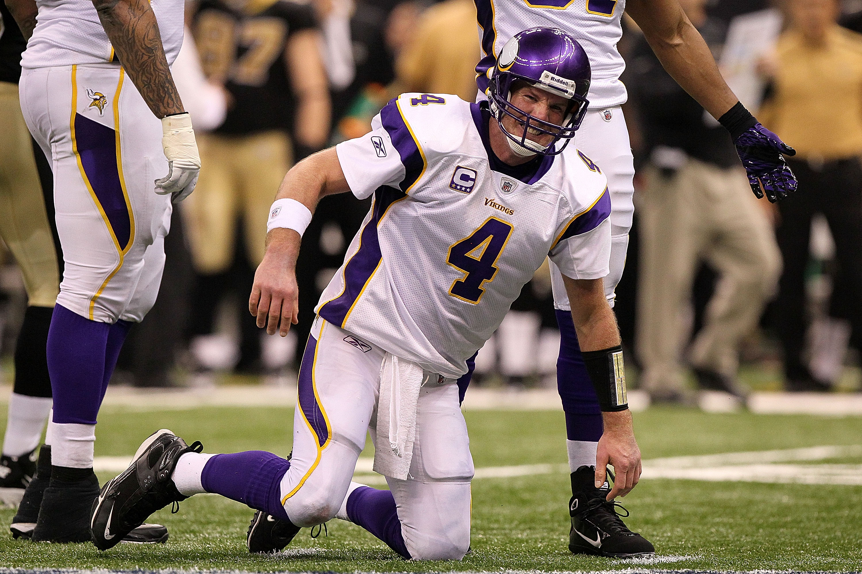 NEW ORLEANS - JANUARY 24:  Brett Favre #4 of  the Minnesota Vikings reacts after taking a hard hit in the second half against the New Orleans Saints during the NFC Championship Game at the Louisiana Superdome on January 24, 2010 in New Orleans, Louisiana.