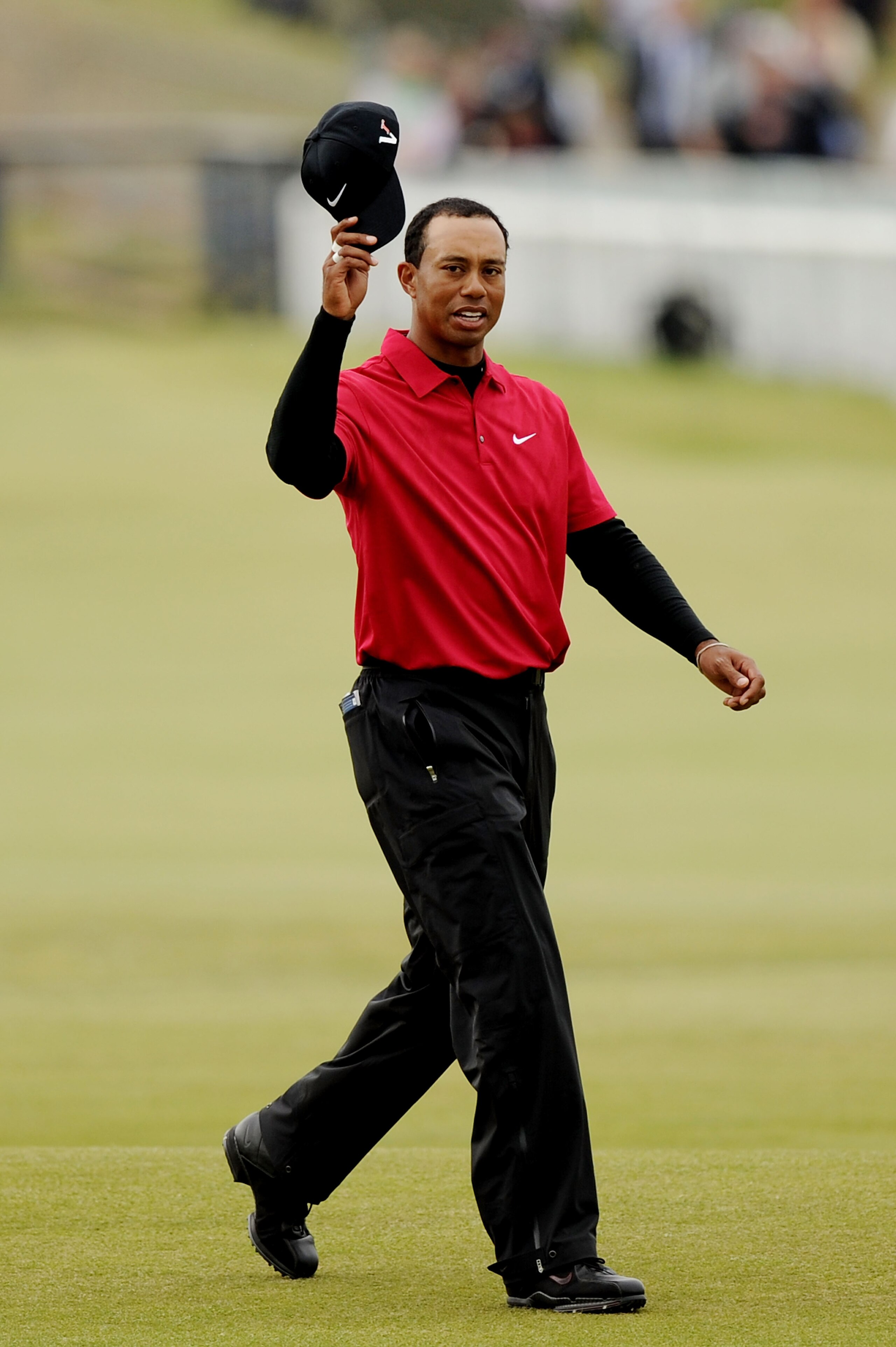 ST ANDREWS, SCOTLAND - JULY 18:  Tiger Woods of the USA walks up the 18th fairway during the final round of the 139th Open Championship on the Old Course, St Andrews on July 18, 2010 in St Andrews, Scotland.  (Photo by Harry How/Getty Images)