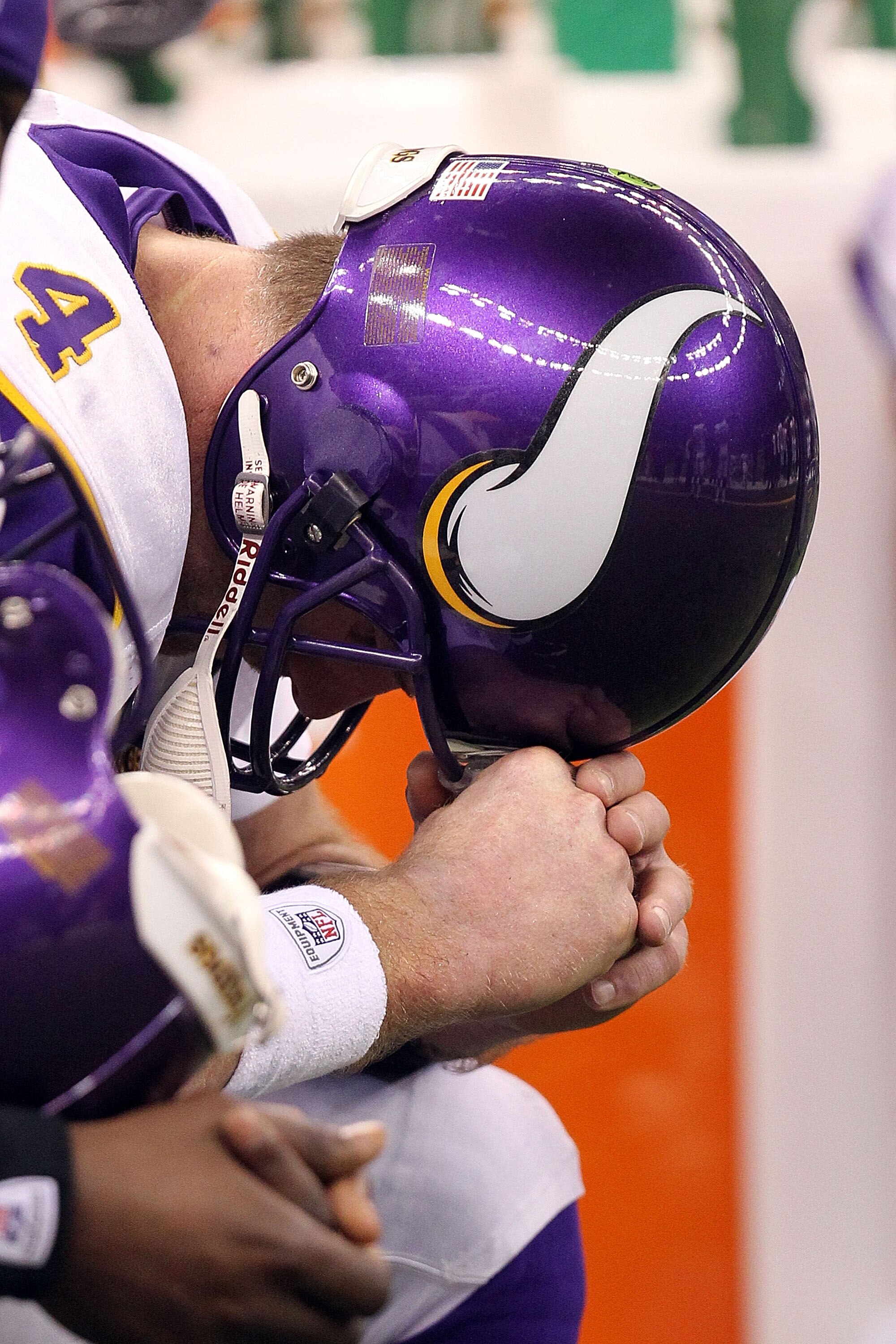 NEW ORLEANS - JANUARY 24:  Brett Favre #4 of the Minnesota Vikings sits on the bench towards the end of the game against the New Orleans Saints during the NFC Championship Game at the Louisiana Superdome on January 24, 2010 in New Orleans, Louisiana.  (Ph