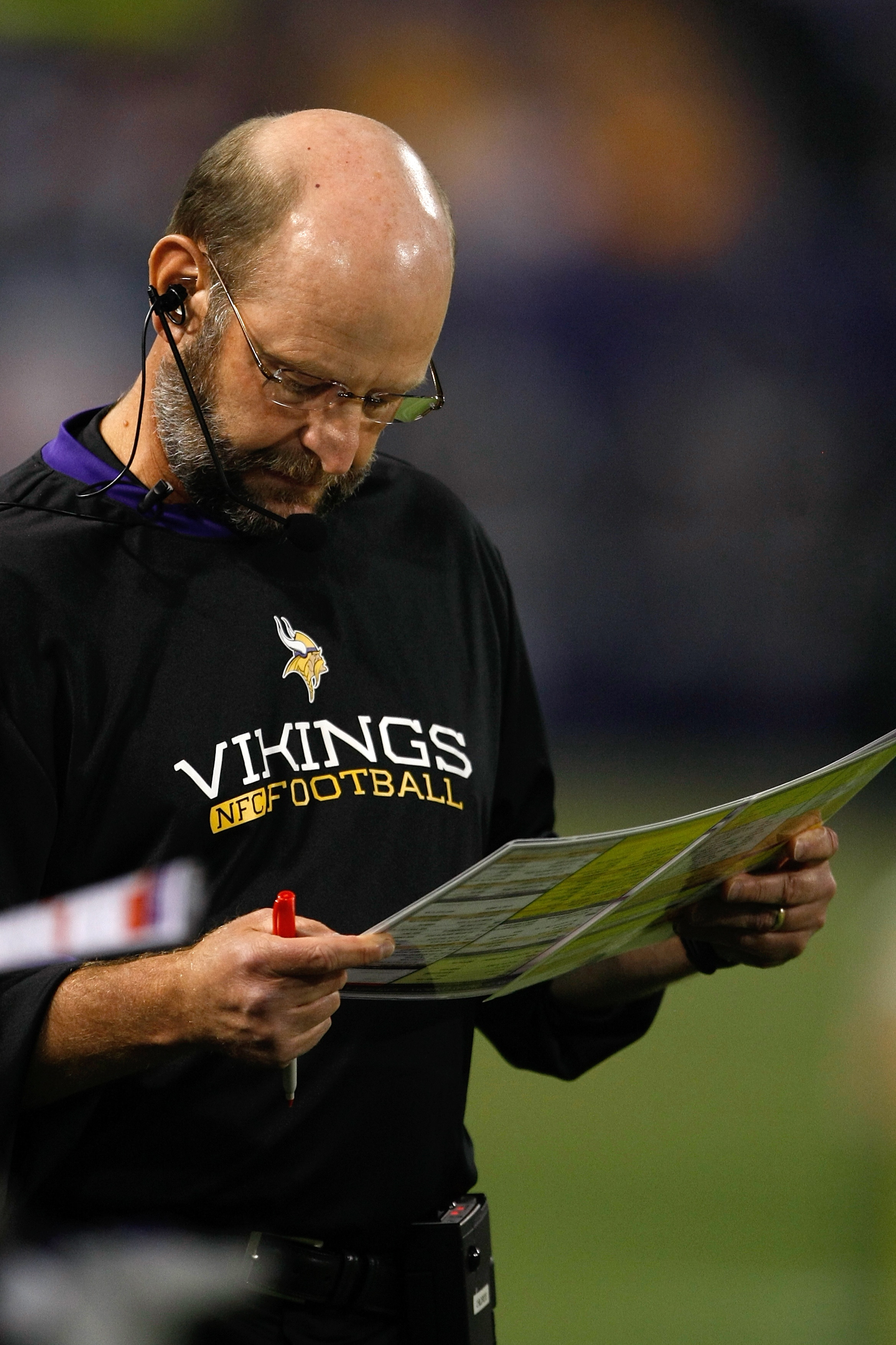 MINNEAPOLIS, MN - SEPTEMBER 4: Head coach Brad Childress of the Minnesota Vikings looks at his play card on the sidelines during action against the Dallas Cowboys at Hubert H. Humphrey Metrodome on September 4, 2009 in Minneapolis, Minnesota. The Cowboys 