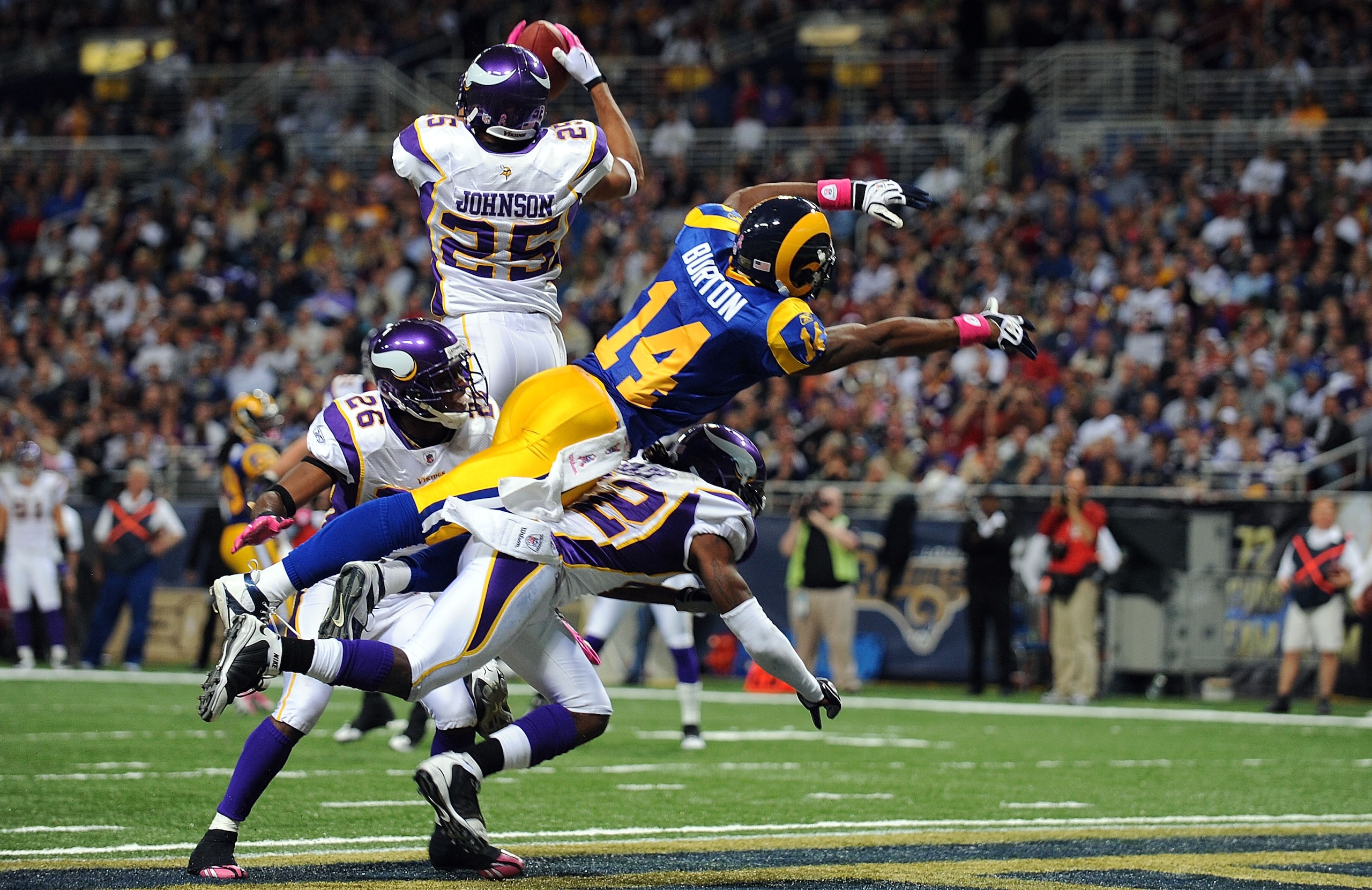 ST. LOUIS - OCTOBER 11: Safety Tyrell Johnson #25 of the Minnesota Vikings makes a pass interception inteded for Keenan Burton #14 of the St. Louis Rams at Edward Jones Dome on October 11, 2009 in St. Louis, Missouri. (Photo by Ronald Martinez/Getty Ima ST. LOUIS - OCTOBER 11: Safety Tyrell Johnson #25 of the Minnesota Vikings makes a pass interception inteded for Keenan Burton #14 of the St. Louis Rams at Edward Jones Dome on October 11, 2009 in St. Louis, Missouri. (Photo by Ronald Martinez/Getty Ima
